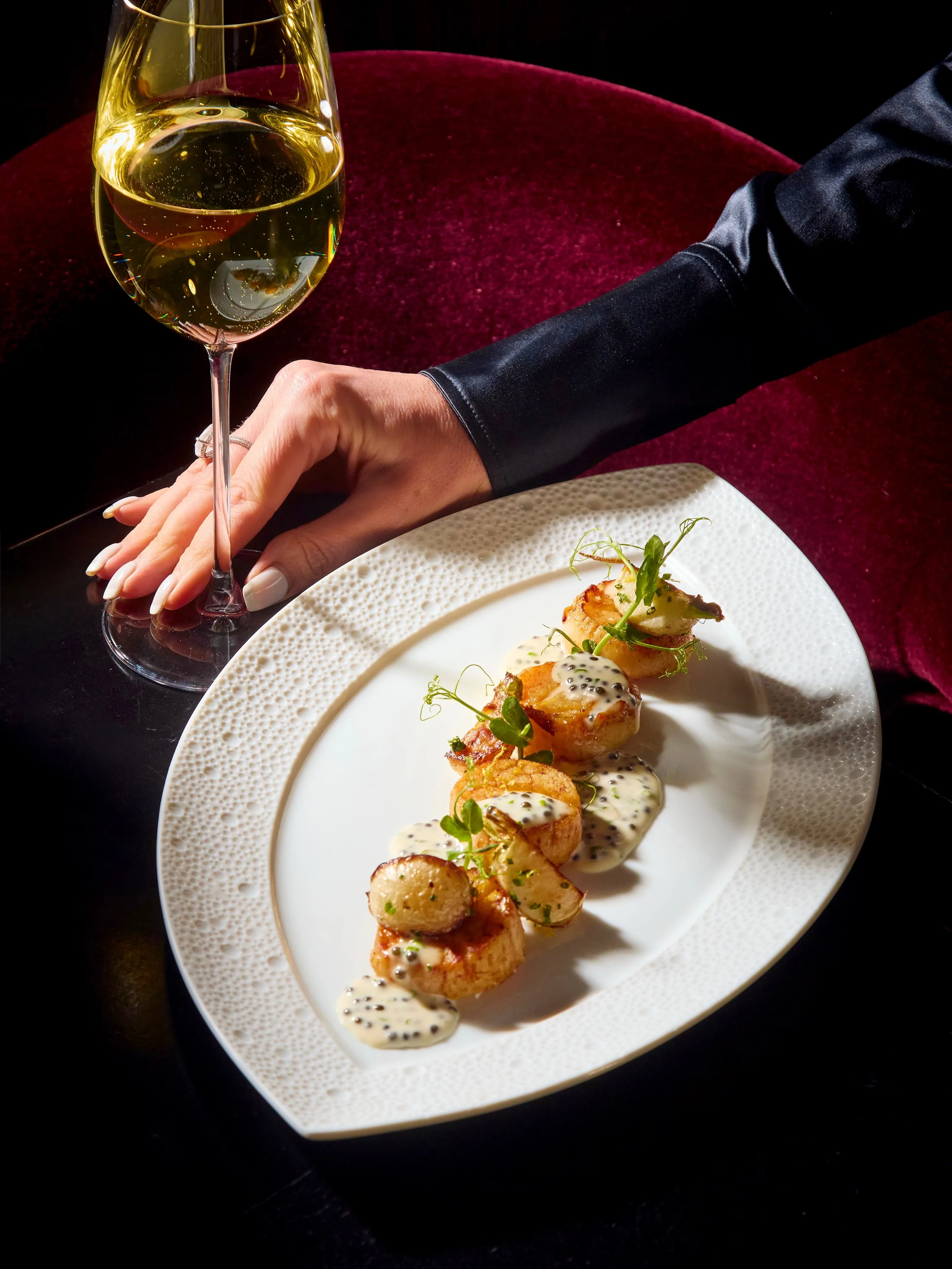 Elegantly plated fresh-caught seafood at CUT Beverly Hills showcasing delicate textures and seasonal coastal accents