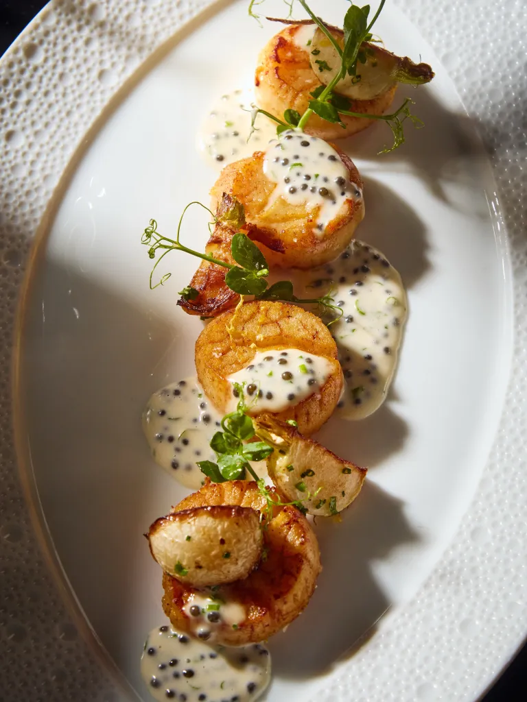 Refined seafood dish demonstrating Wolfgang Puck's precision technique and vibrant seasonal ingredients at CUT restaurant