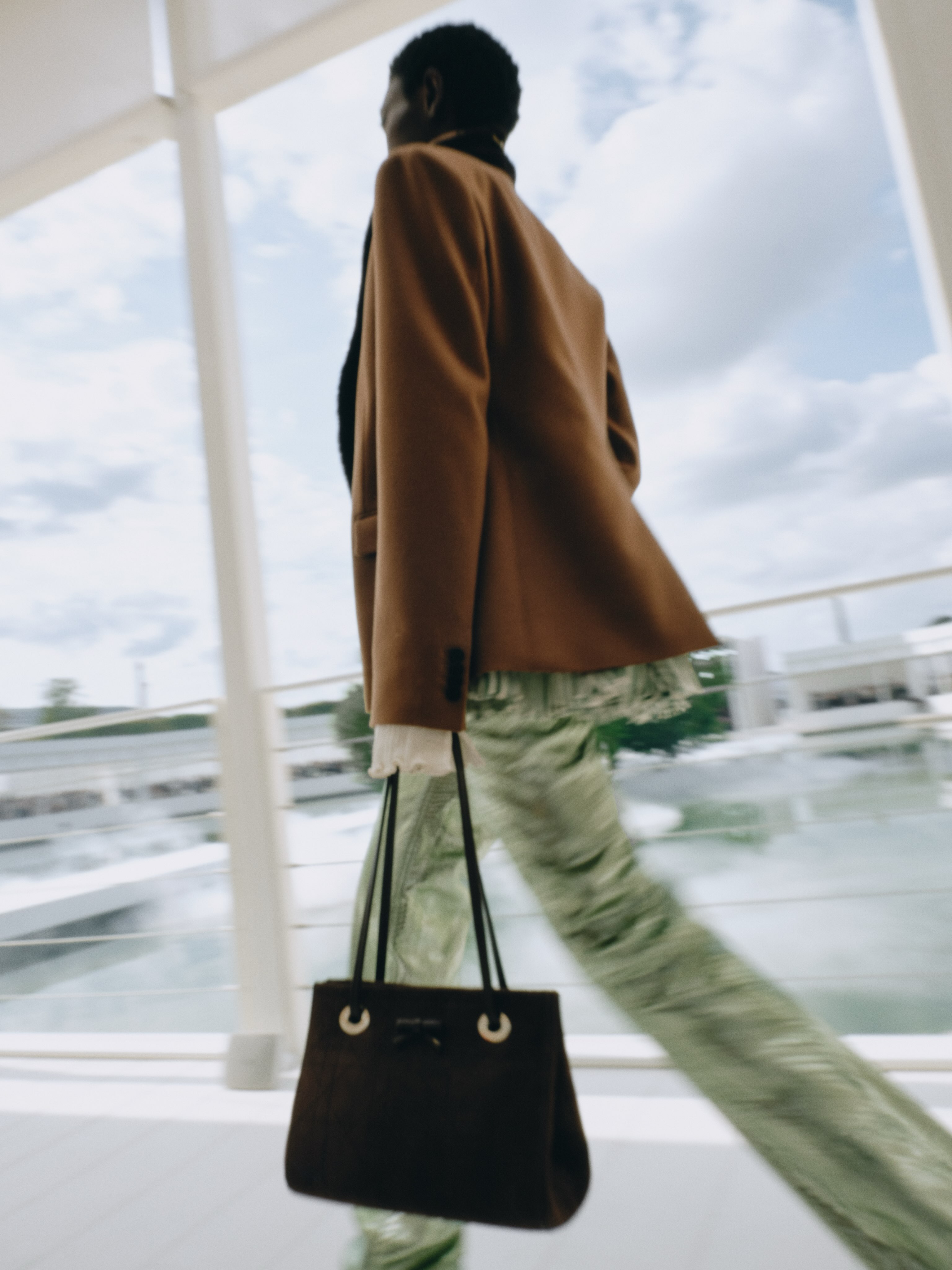 Final model on runway in completed ensemble from Dior Summer 2027