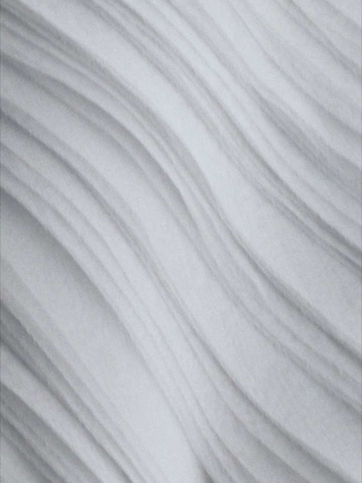 Close-up of delicate fabric texture and refined tailoring details