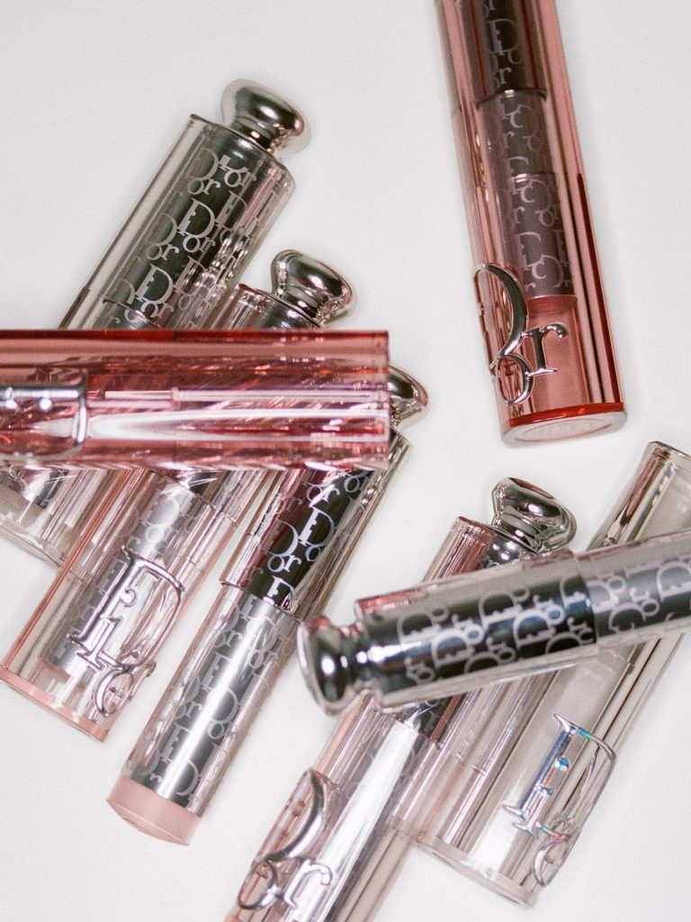 Model showcasing glowing skin with subtle silver highlights and rosy flush at Dior Summer 2027
