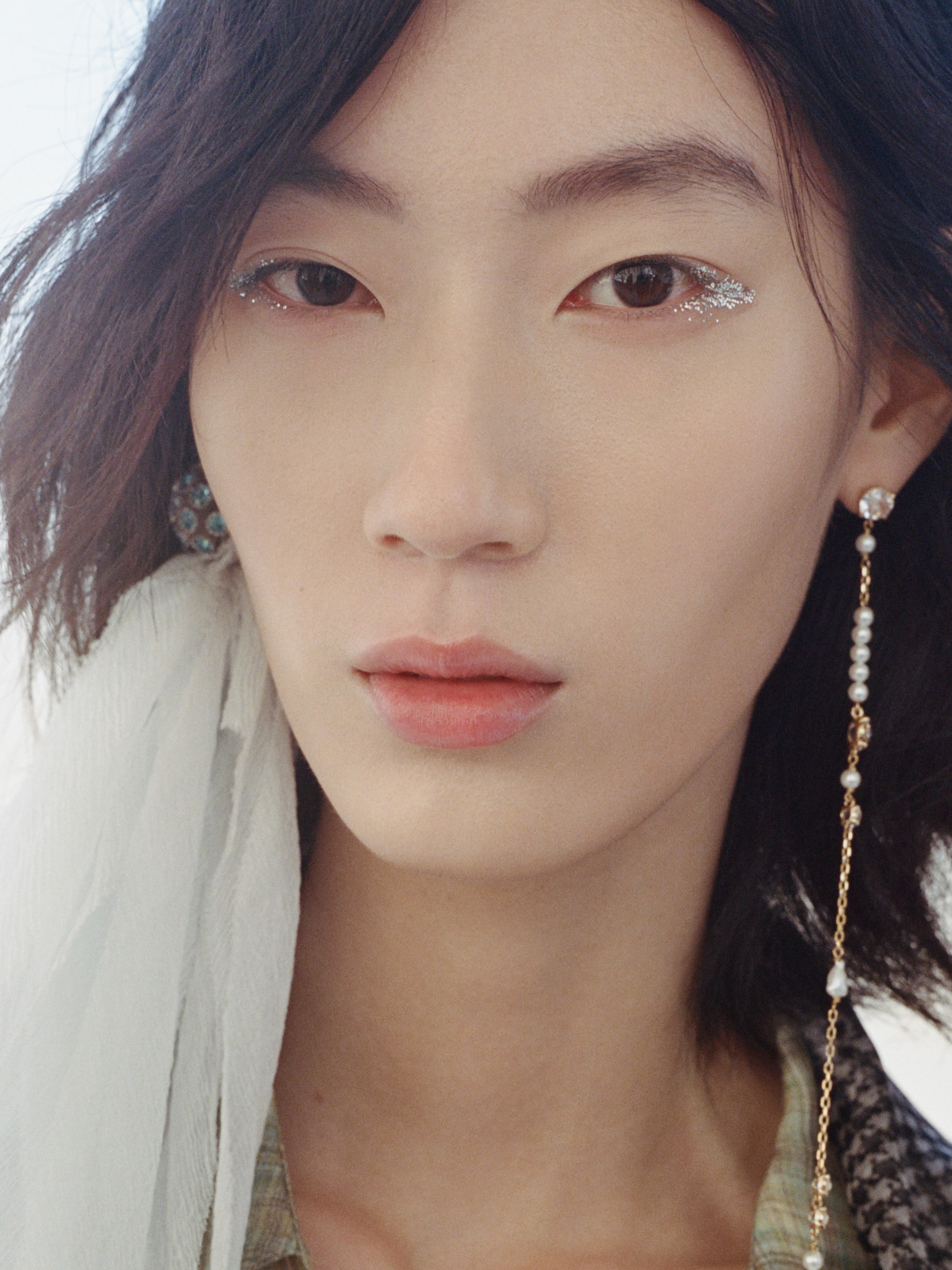 Beauty close-up featuring Dior makeup with ethereal silvered tones and radiant flush