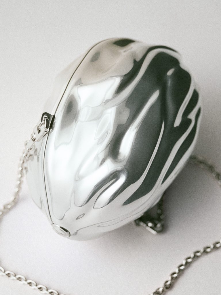 Ensemble of coordinated accessories demonstrating the collection's coherent design philosophy
