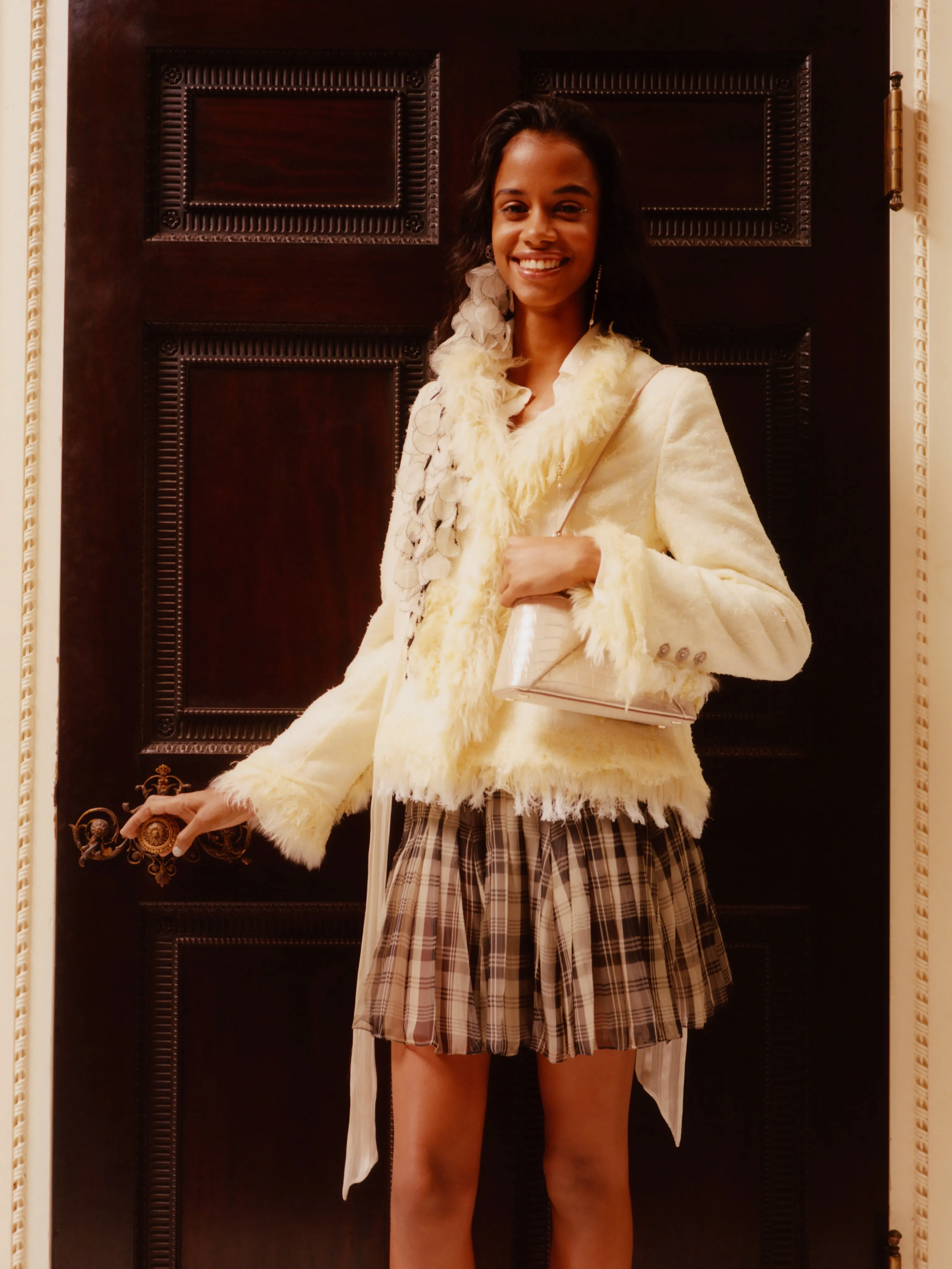 Model wearing flowing Dior Summer 2027 ensemble in soft neutral tones