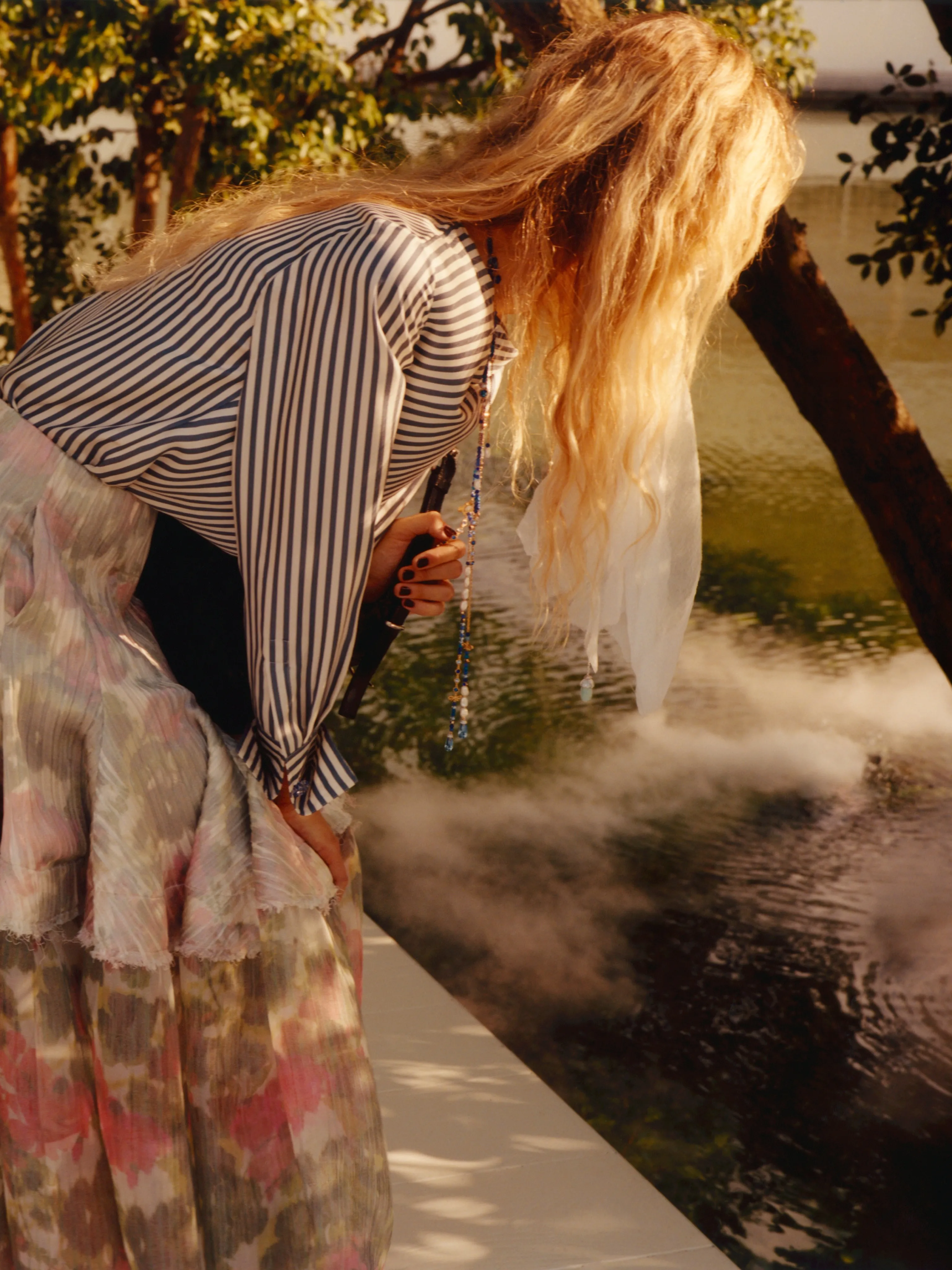 Fluid evening wear capturing movement and elegance in jewel tones