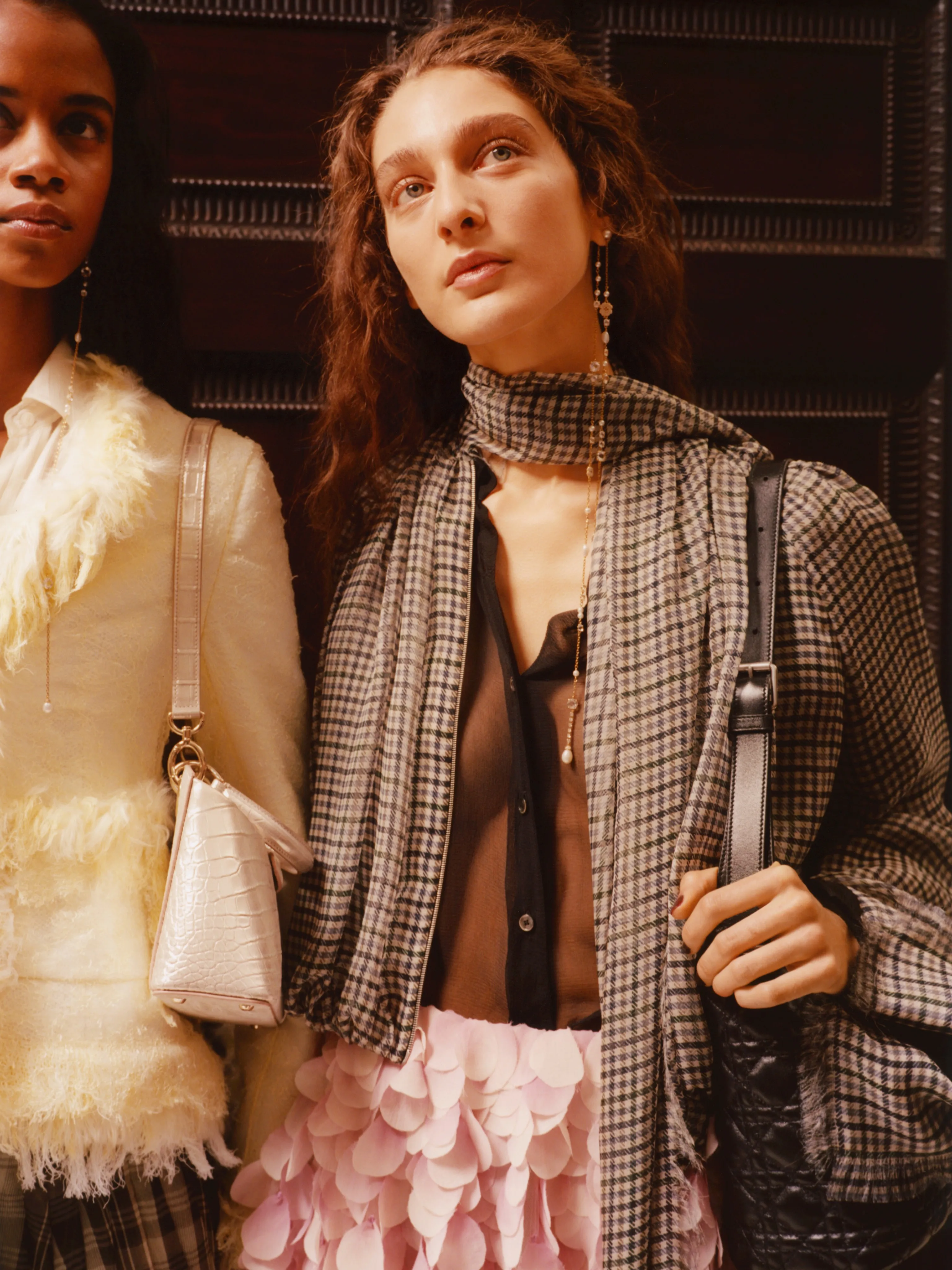Model wearing layered neutral tones demonstrating proportion and balance