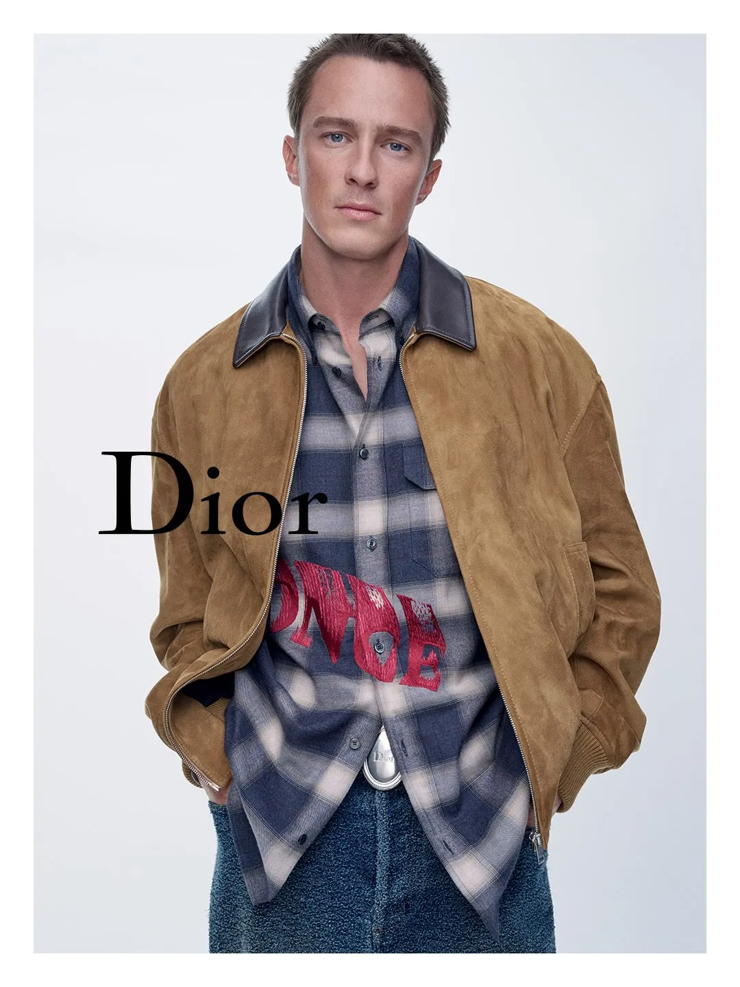 Drew Starkey in Dior Spring 2027 collection posed in contemplation at LACMA art gallery