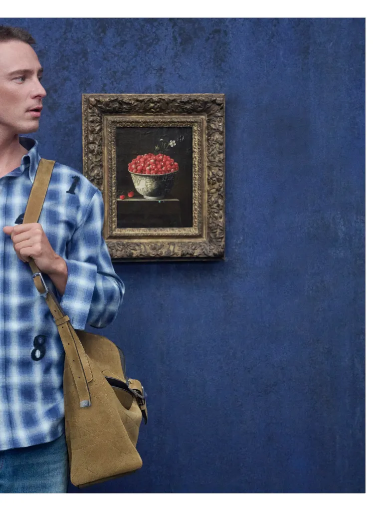 Campaign image from Dior Spring 2027 featuring refined tailoring at LACMA gallery setting