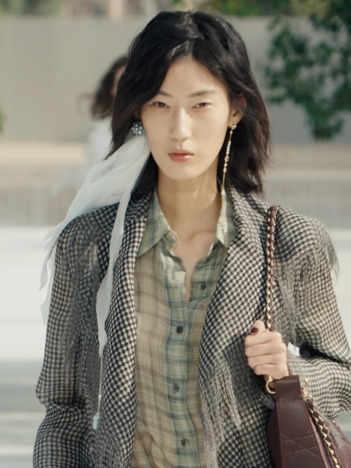 Model's face showcasing fresh beauty look with defined brows and radiant skin