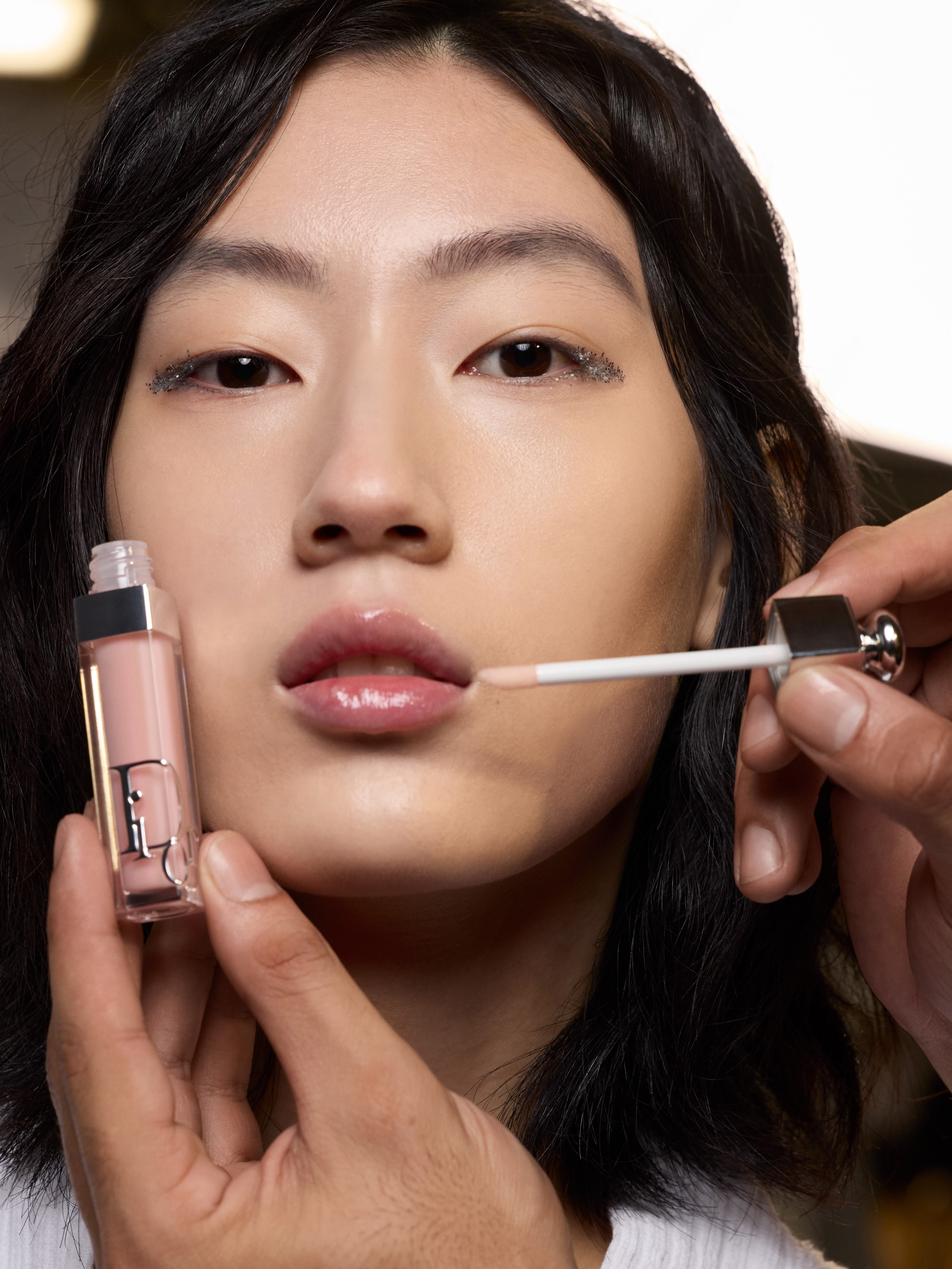 Detailed shot of the lip and brow products in use during show preparation