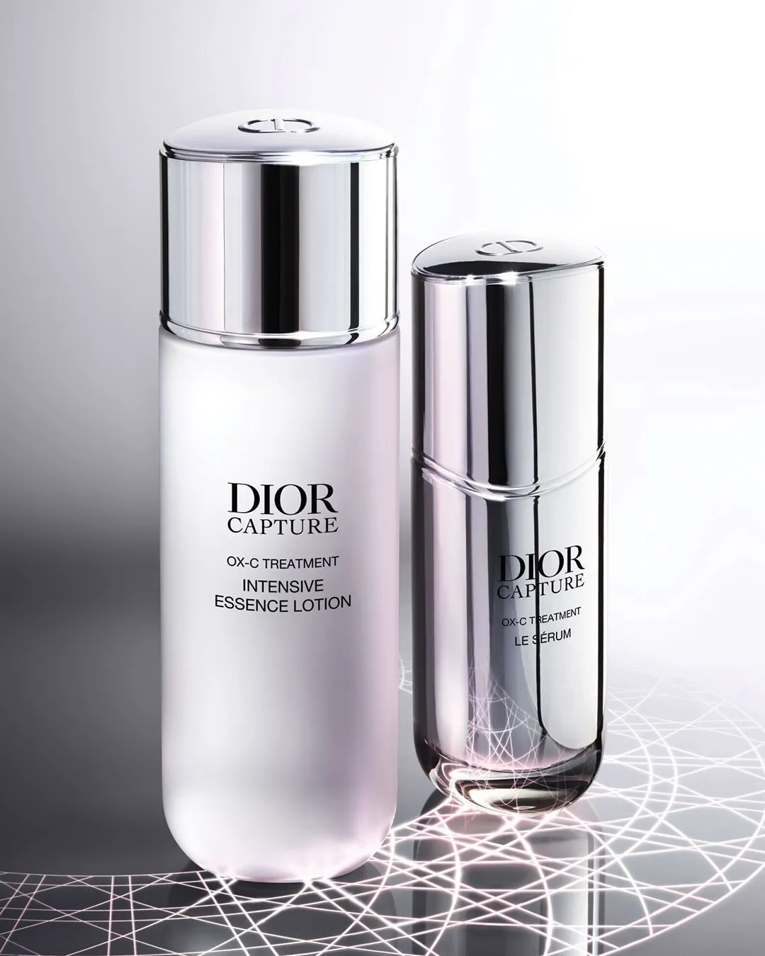Dior Beauty Intensive Essence Lotion and advanced Sérum displayed together, showcasing the high-performance skincare duo