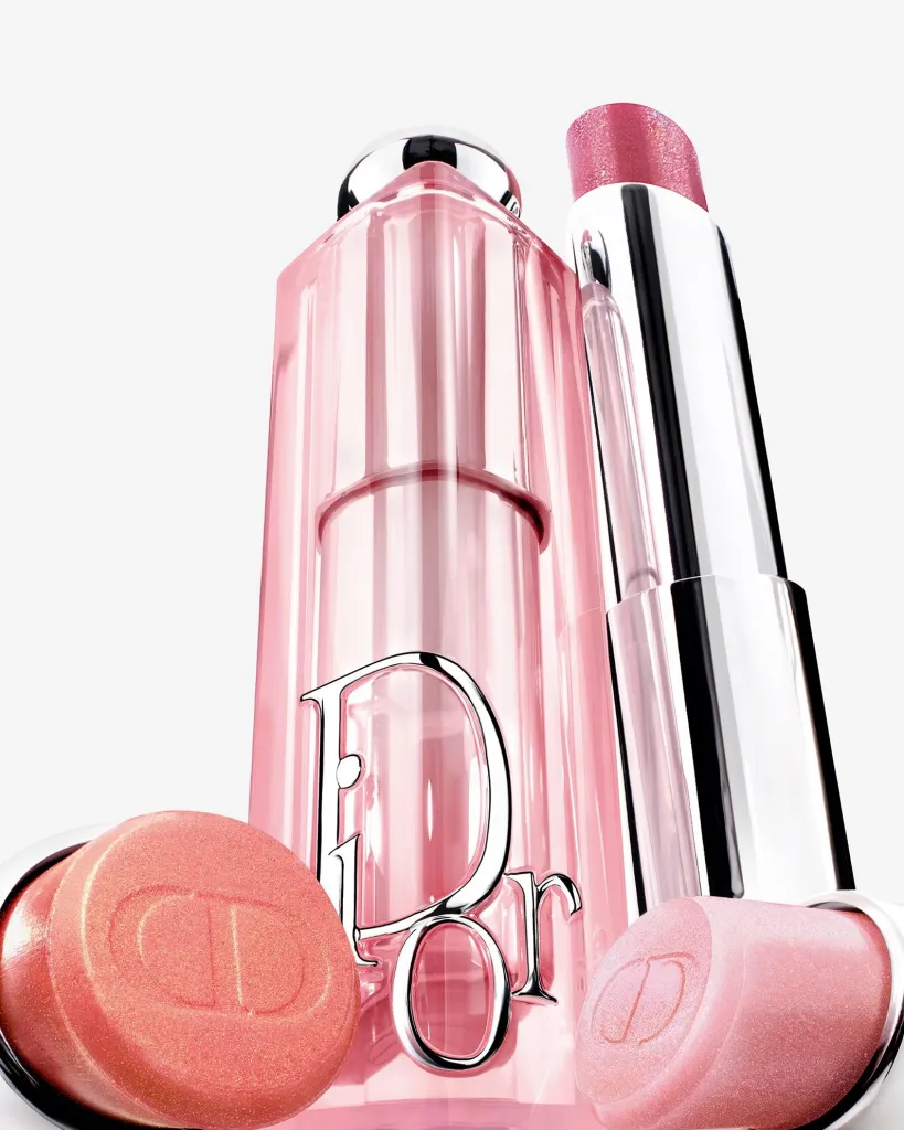Close-up detail of the Pop Glows collection displaying the prismatic shimmer and light reflecting qualities of the palette and lip products