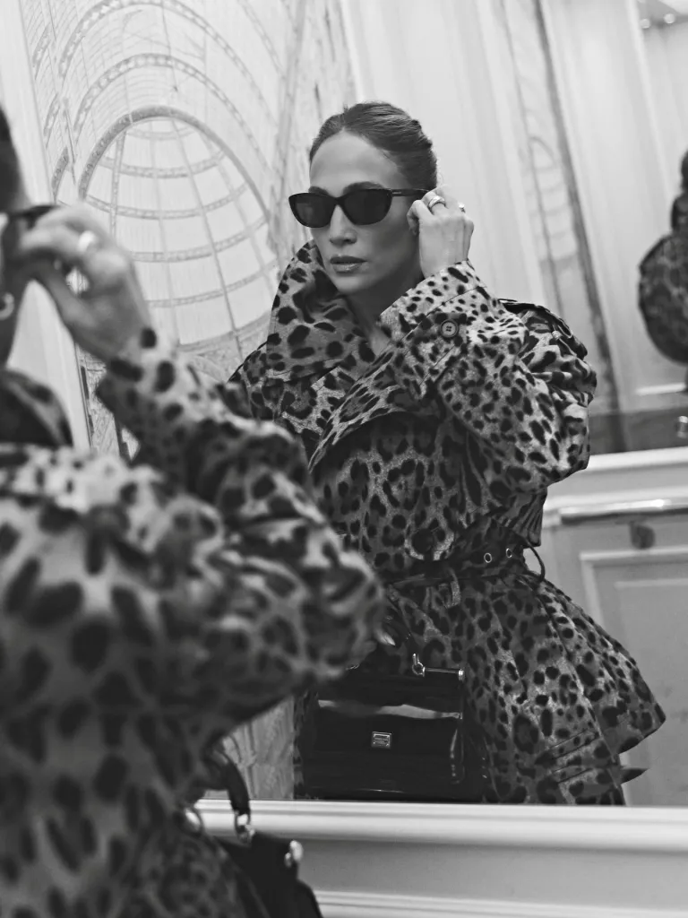 Detail view of the DG Leo print fabric on the cropped trench coat