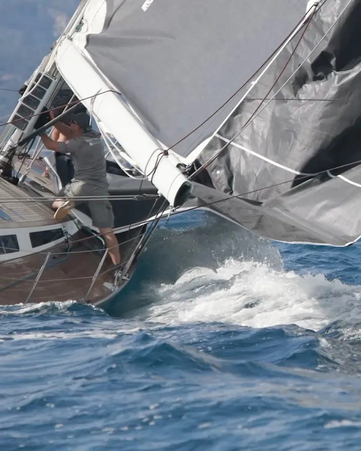 Maxi 1 racing crew executing manoeuvres under competitive conditions