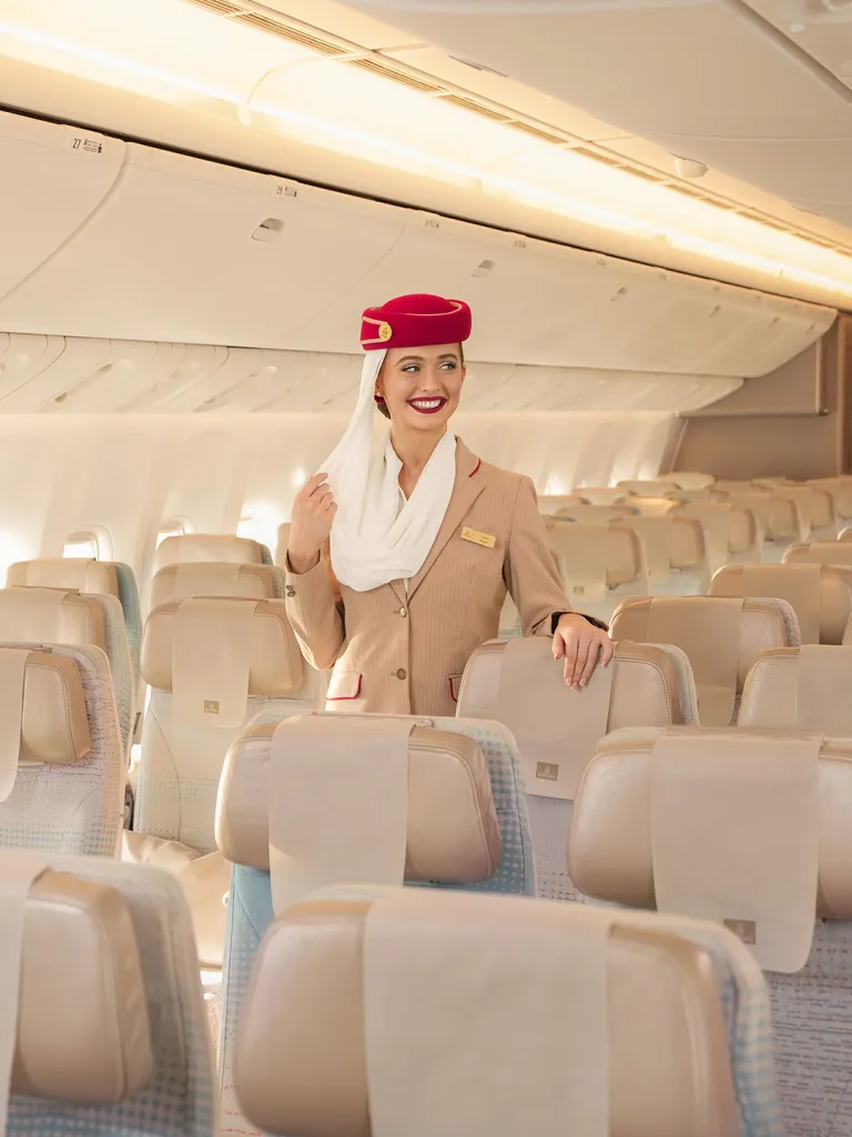 Emirates cabin crew delivering luxury service to passengers