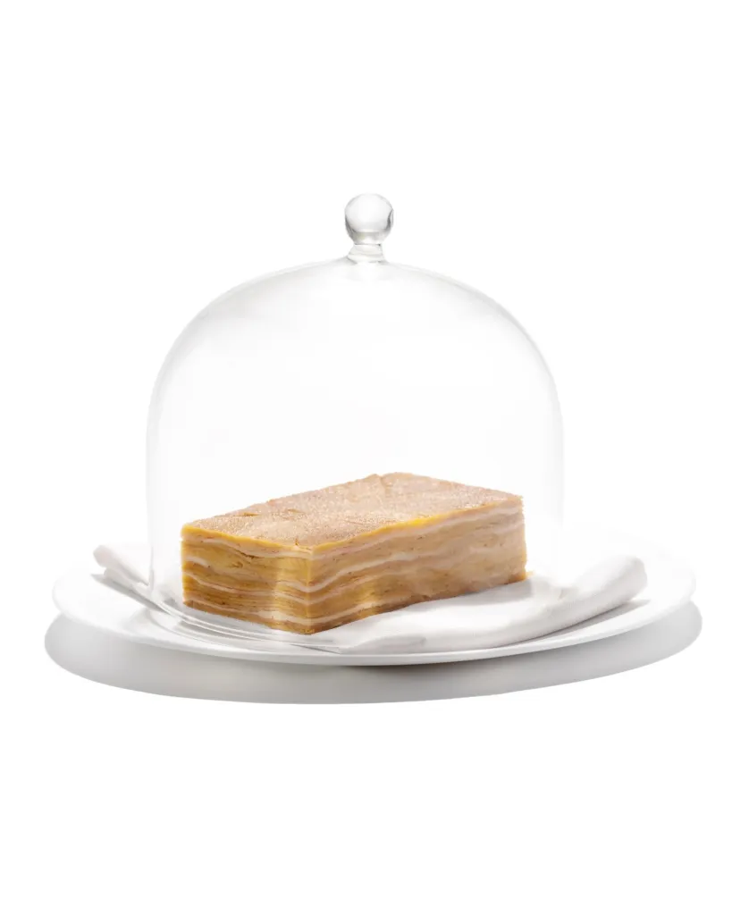 Seared chicken skin terrine displaying crispy golden exterior achieved through griddle marking, served with silken emulsion