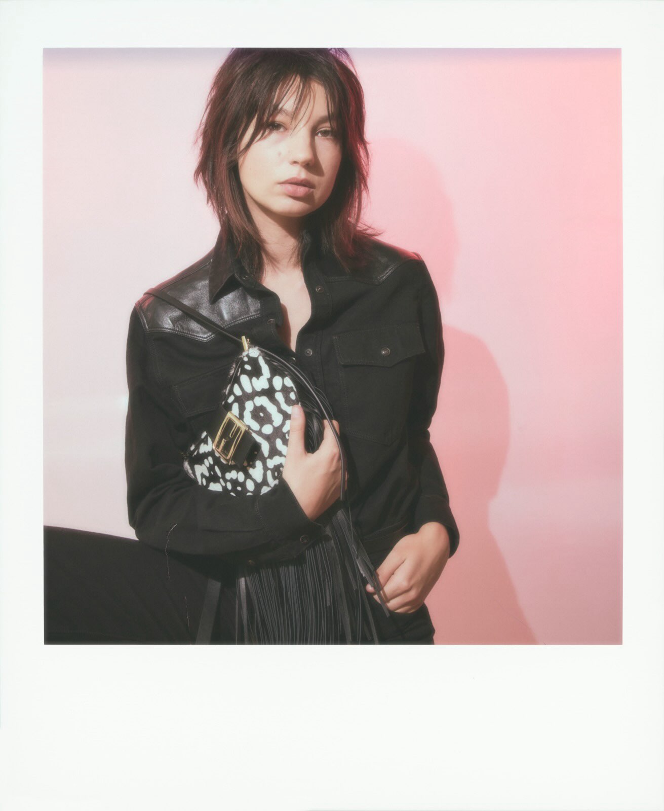 Eva Yelmani holding the leopard print Croissant bag during backstage preparations for Fendi's Spring Summer 2027 collection