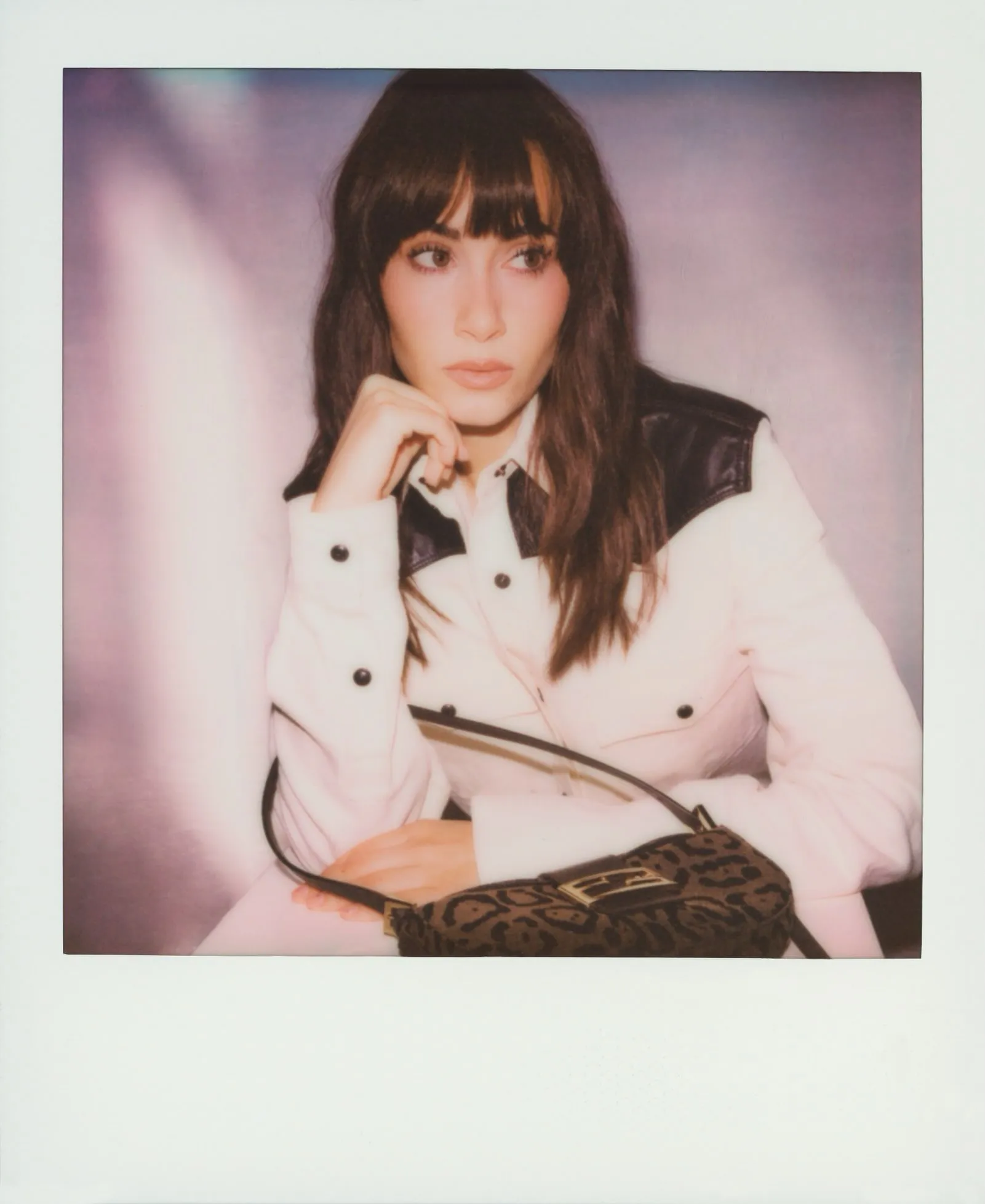 Model Aitana holds Fendi's leopard print Croissant bag, captured behind the scenes at the Spring/Summer 2027 show by photographer Maripol