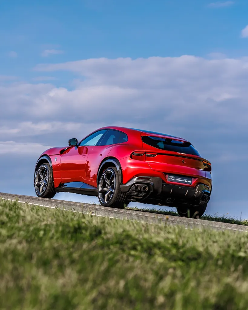 Dynamic side view emphasising the SUV's commanding stance and aerodynamic contours