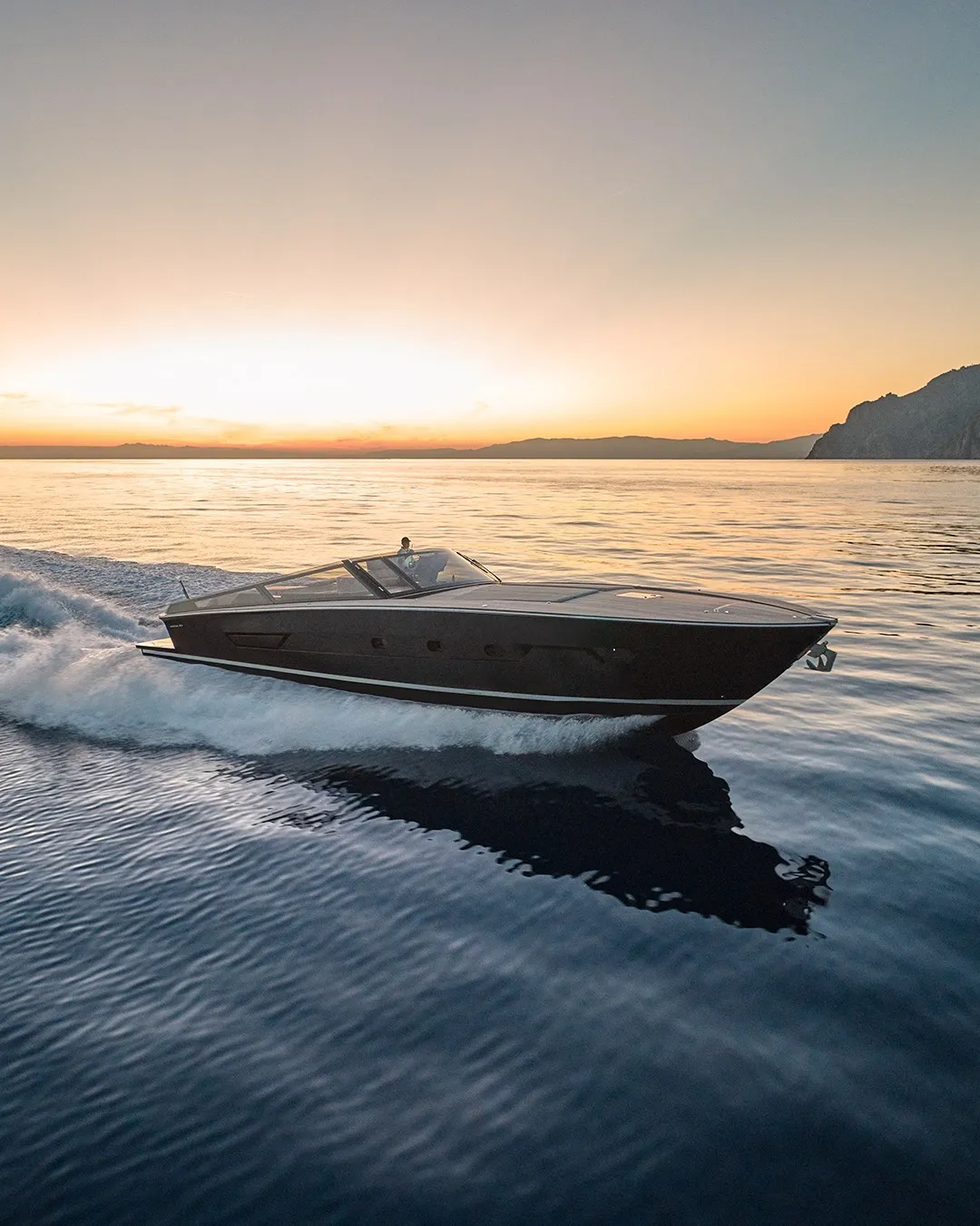 The Itama 54 luxury yacht showcasing signature elegant lines and expansive sunlit deck spaces, embodying Ferretti Group's maritime design mastery