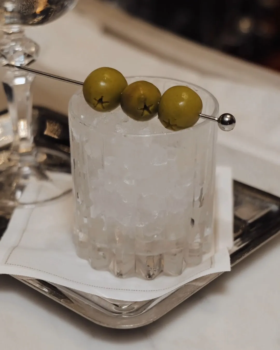 Close-up of the Chandelier Martini cocktail showcasing its crystalline clarity and elegant presentation