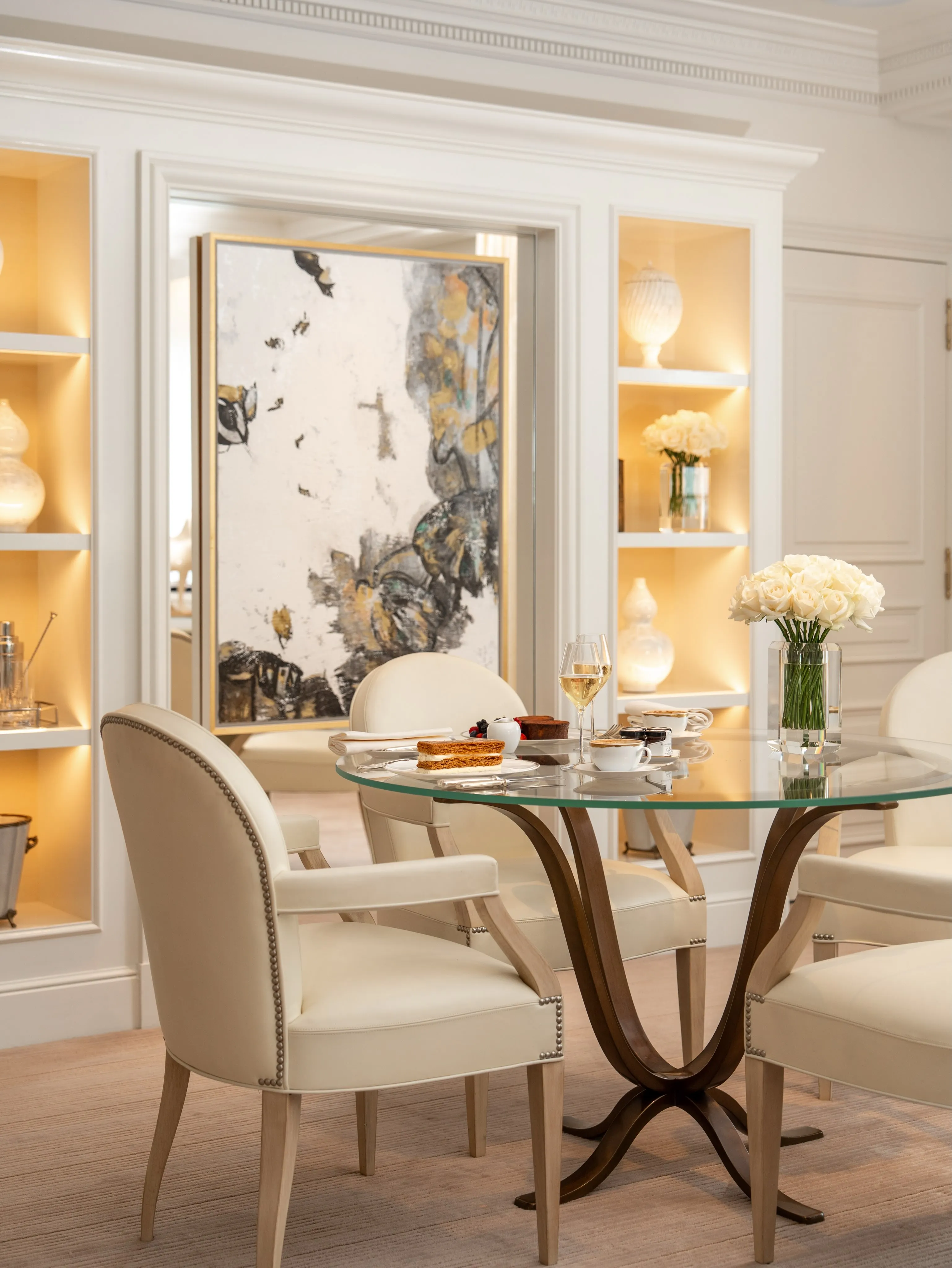 Luxurious Four Seasons suite featuring elegant furnishings, soft lighting and refined Parisian decor