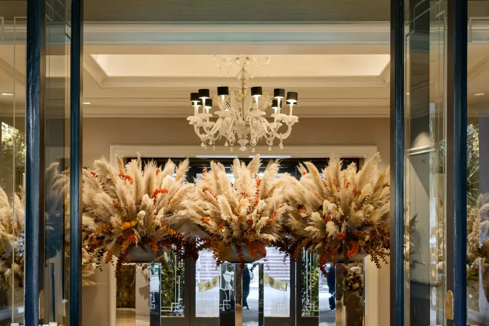 Jeff Leatham's autumn floral installation at Four Seasons Los Angeles featuring layered natural textures and rich fall colours in the arrival lobby