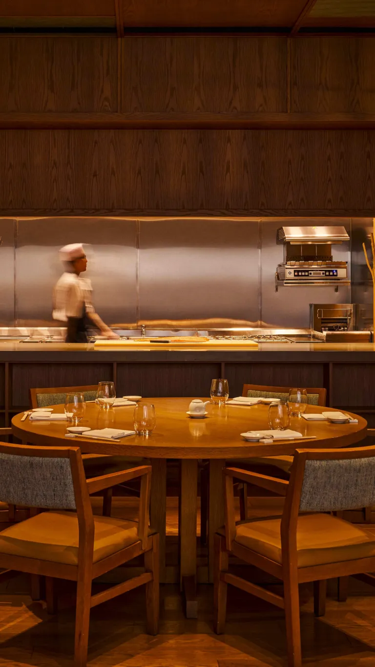 The Chef's Table at Nobu Singapore with integrated kitchen showcasing live culinary preparation and plating