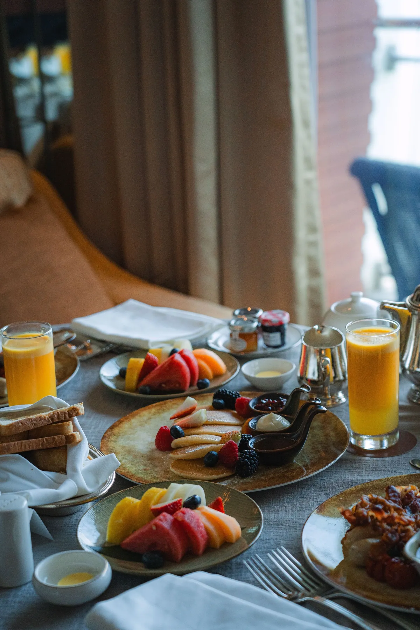 Elegant breakfast service in a luxury hotel room overlooking Marina Bay, Singapore's iconic waterfront at dawn