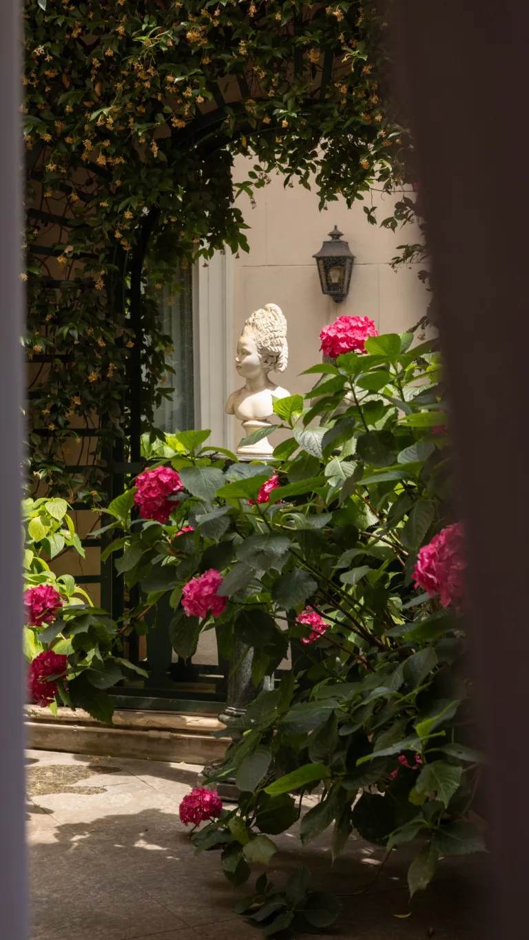 An elegant morning scene at Gh Hotel de Milan, showcasing refined table settings and serene surroundings that embody understated luxury and unhurried sophistication