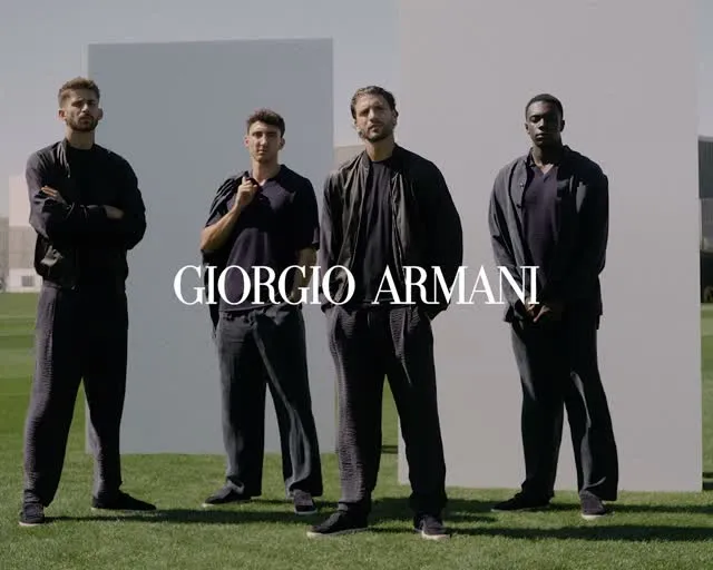 Juventus first team in Giorgio Armani formal wardrobe showcasing elegant silhouettes and sophisticated styling