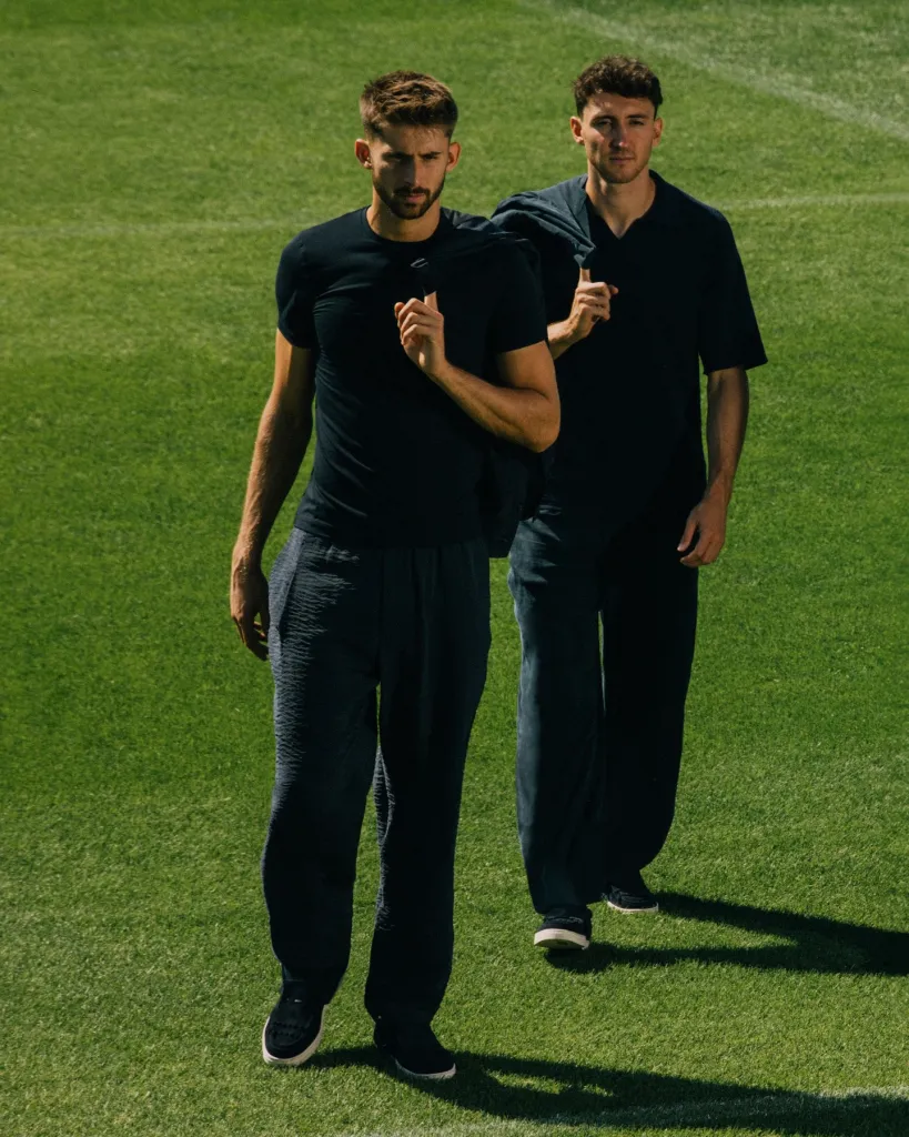 Juventus player wearing Giorgio Armani official wardrobe ensemble with refined tailoring