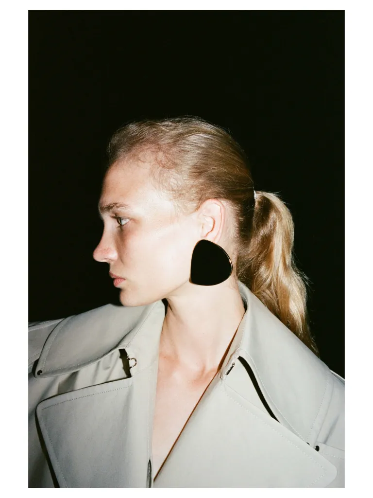 Full-length view of the collection showing architectural silhouettes in neutral palette