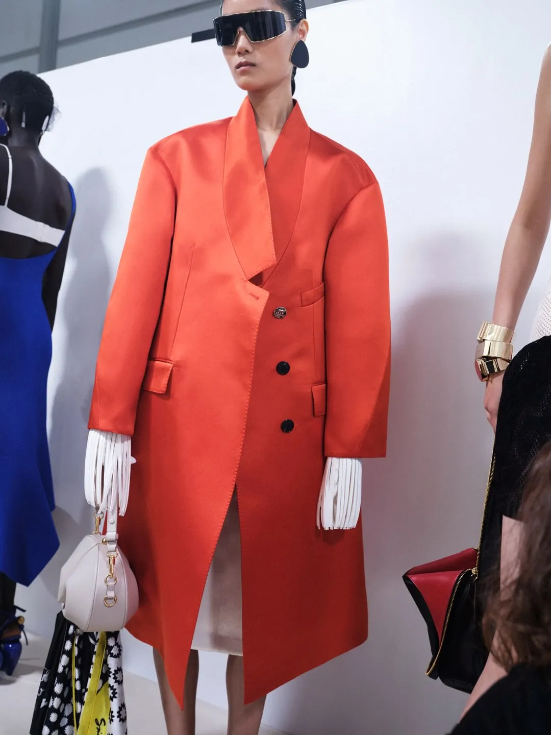 Full length view of sculptural Givenchy garment with strategic fabric slashing