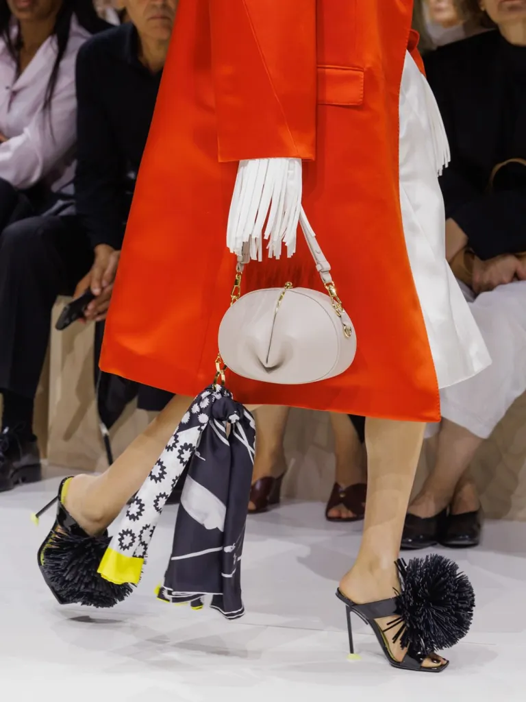 Layered cocoon shapes demonstrating volume and drape mastery