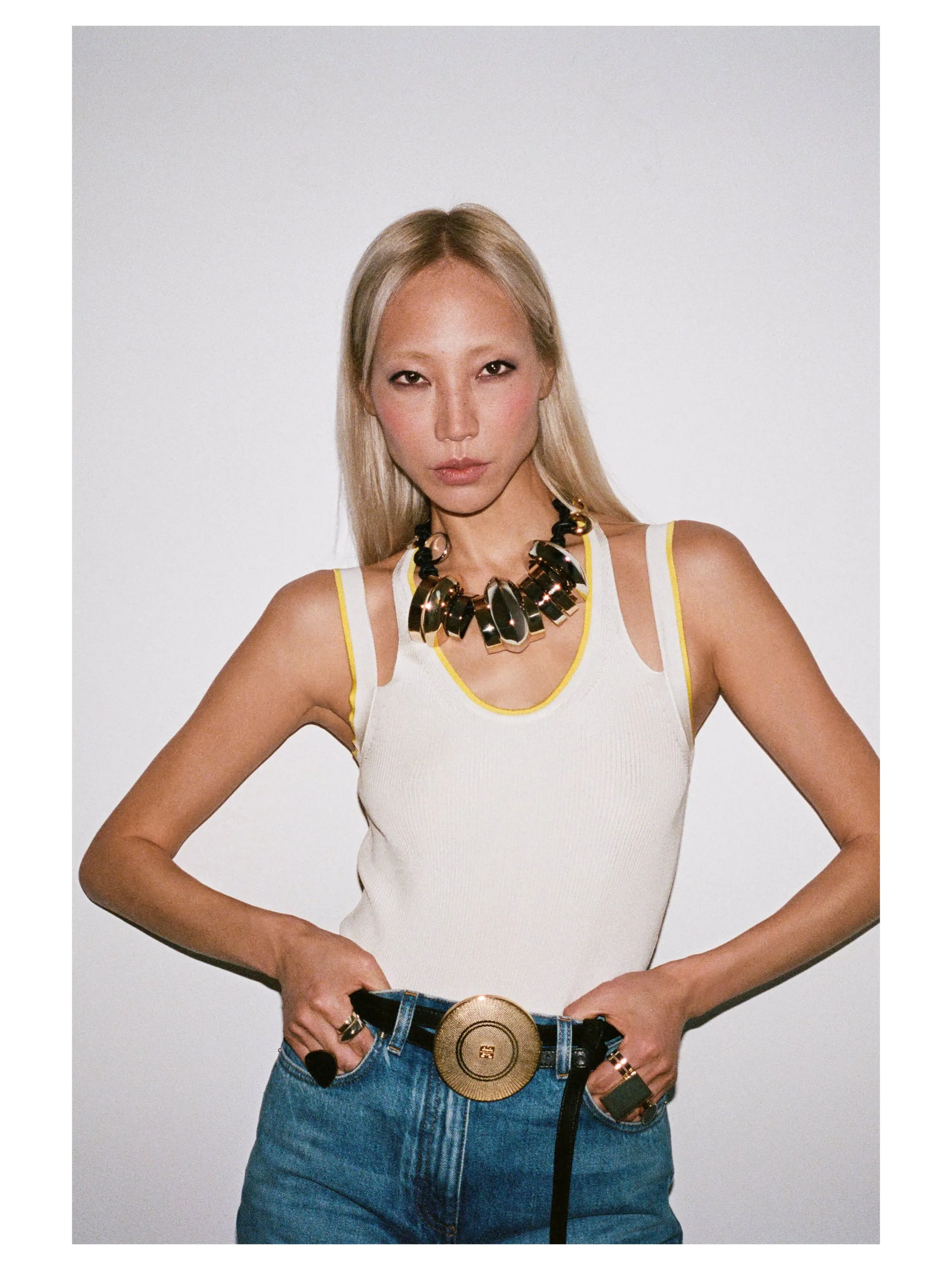 Detailed view of the Powder Puff belt's sculptural buckle and refined construction