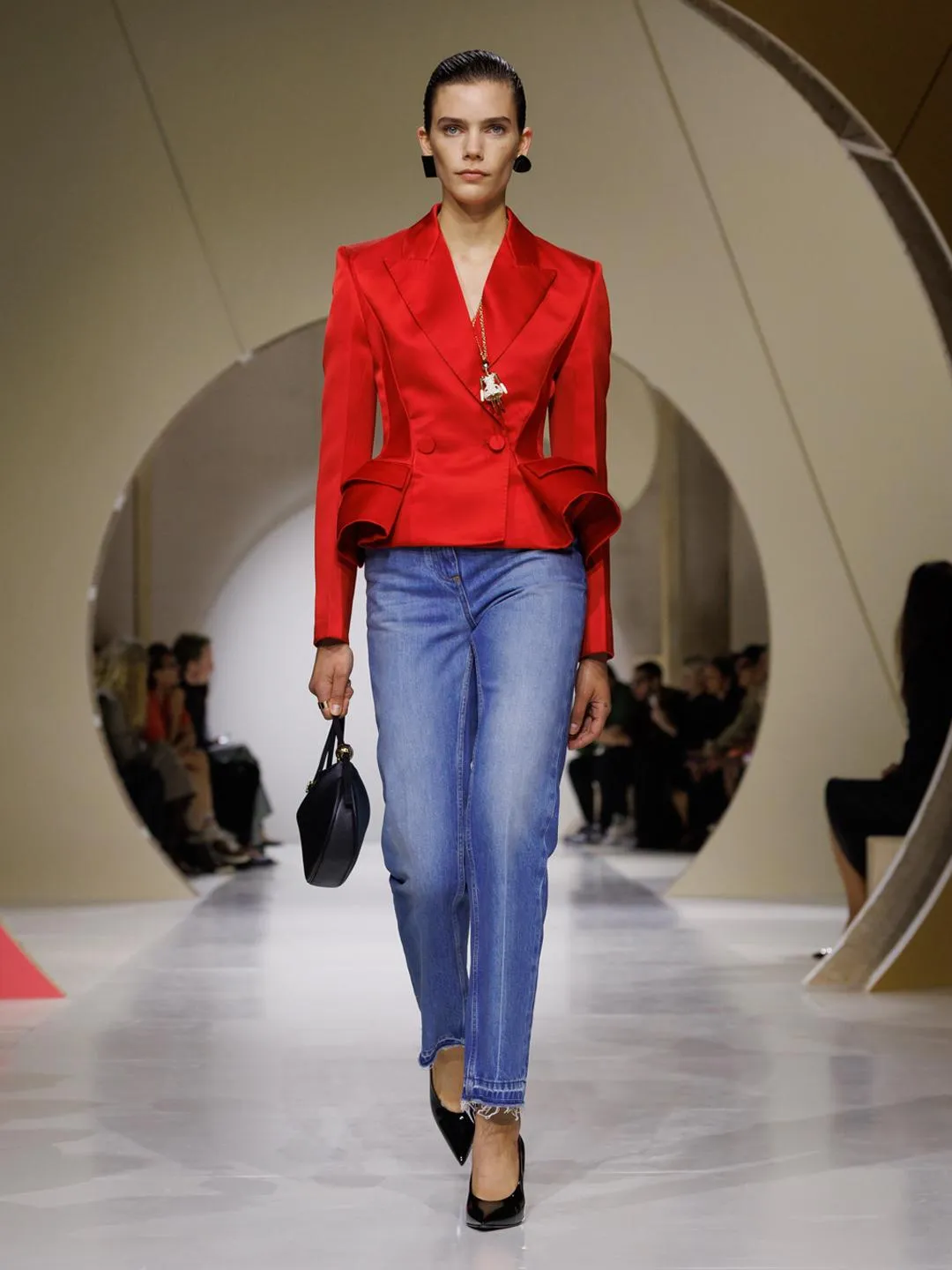 Model in full look combining Givenchy Prism jewellery and peplum jacket tailoring