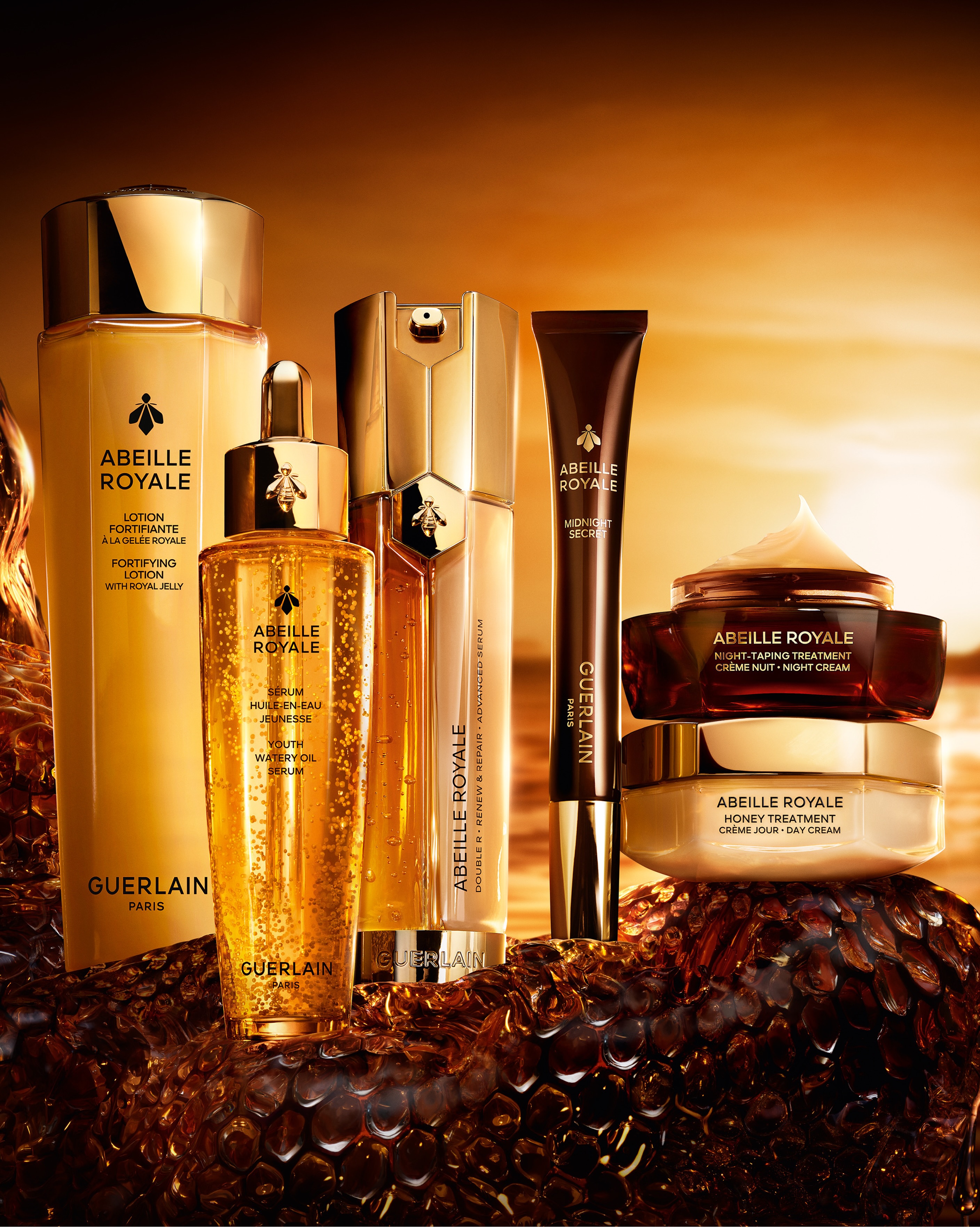 Guerlain Abeille Royale skincare collection featuring fortifying lotion, youth serum, Double R repair serum and new night-time treatments in elegant amber and gold vessels