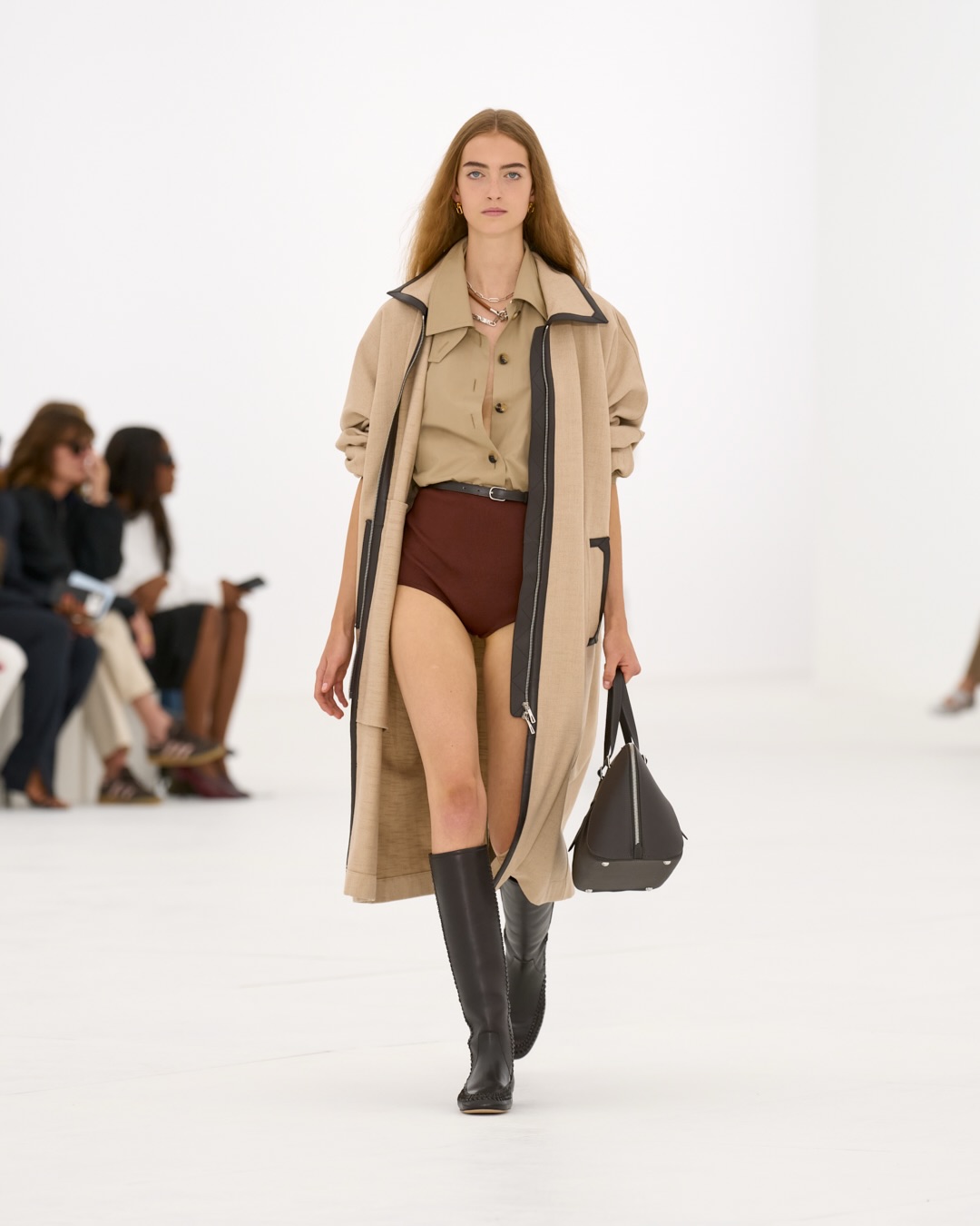 Model wearing pale sage modular separates with lifted hemline and billowing sleeve detail