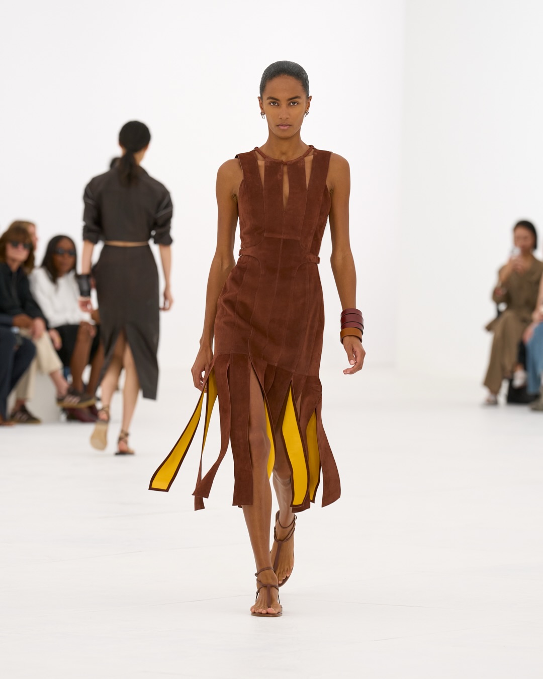 Figure in motion wearing gossamer silk with choreographed drapery and floating hem