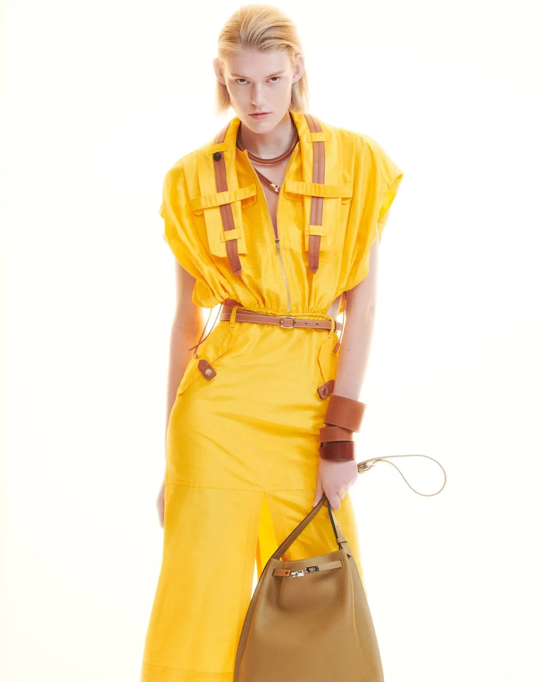 Detail of elegant tailored piece with lifted hem and considered proportions, showcasing Hermès craftsmanship