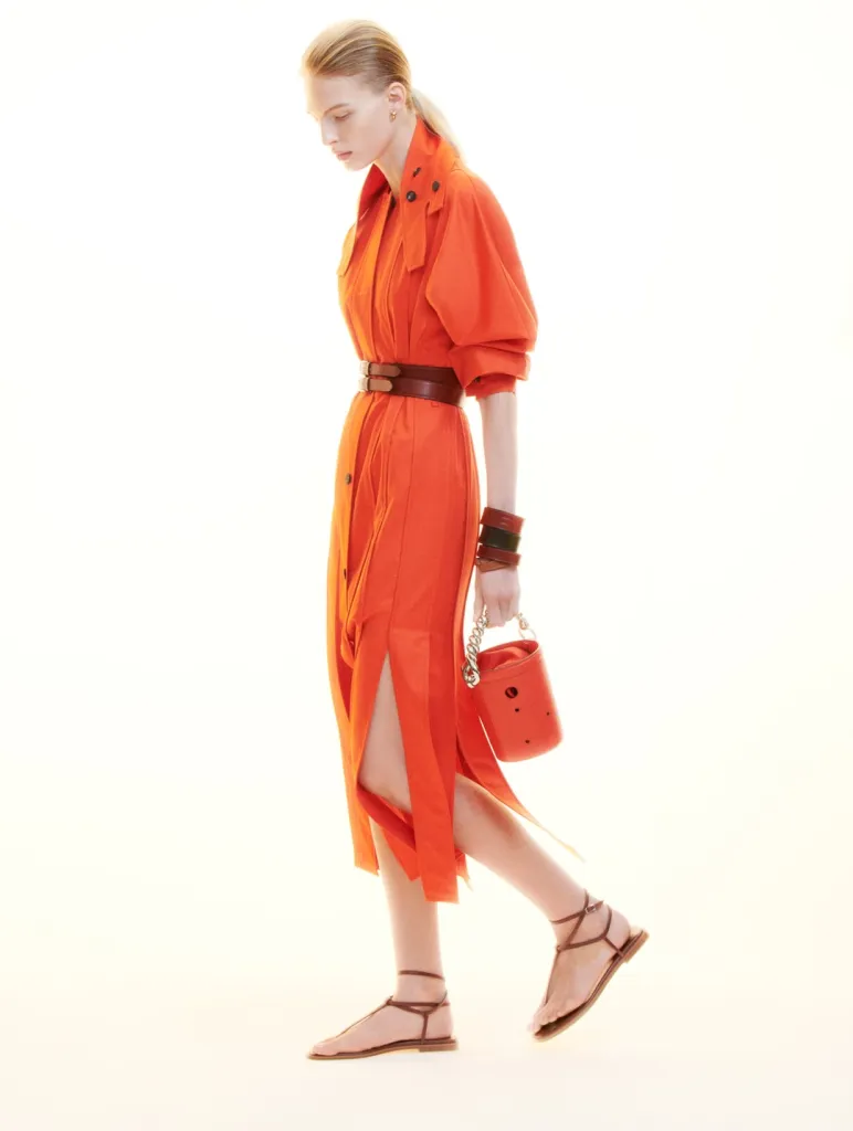 Close-up detail of architectural seaming and fabric construction on Hermès garment with soft neutral palette