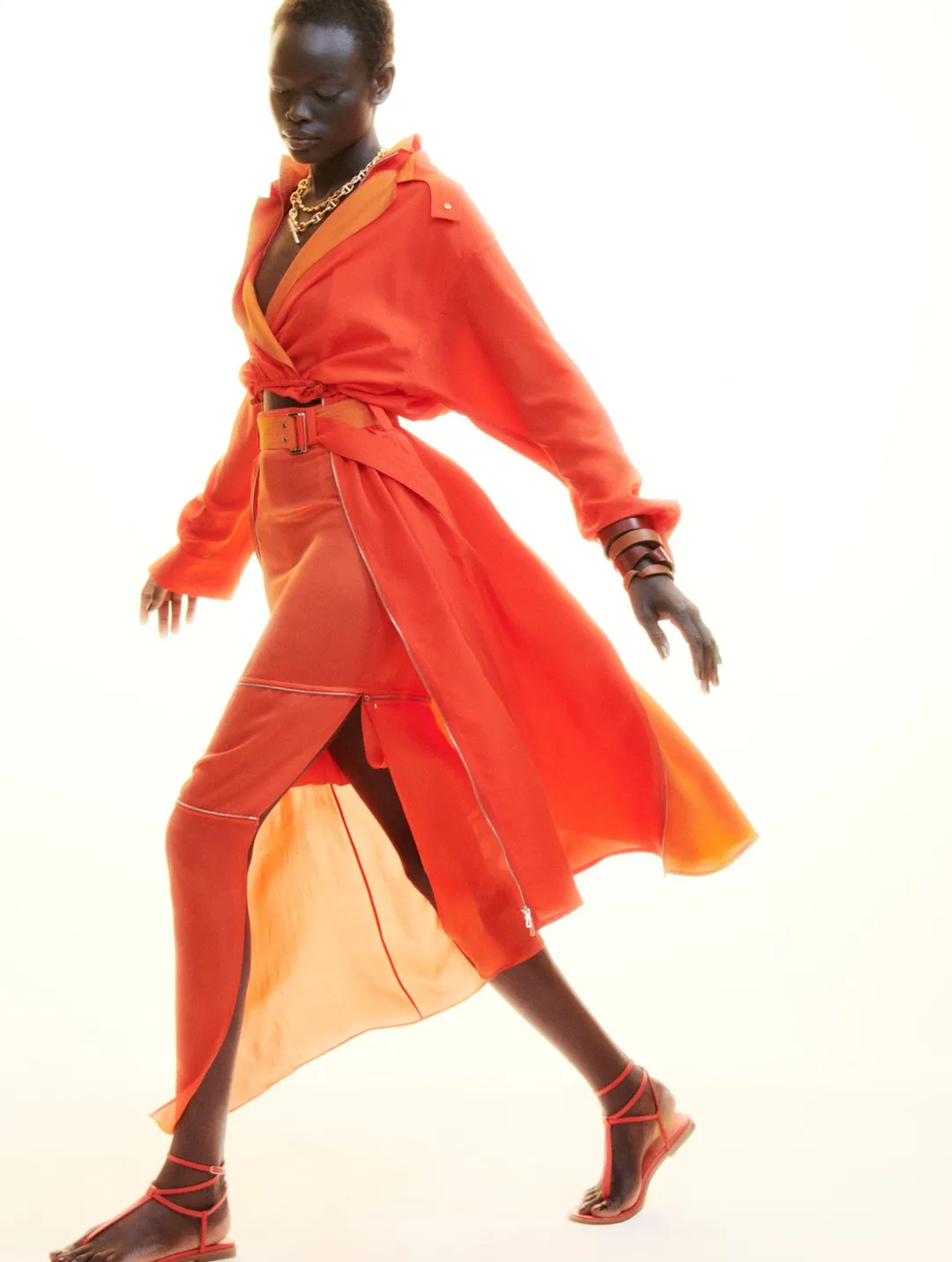 Model wearing layered neutral tones with sculptural silhouettes embodying spring-summer 2027 aesthetic