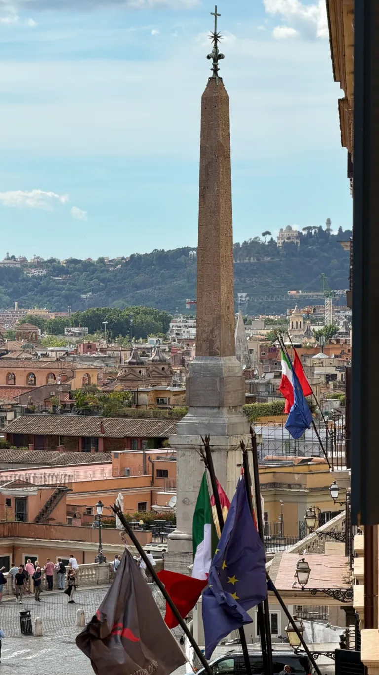 Cielo rooftop sanctuary at Hotel de la Ville in Rome, with expansive views of the city's rooftops and domes beneath an open sky
