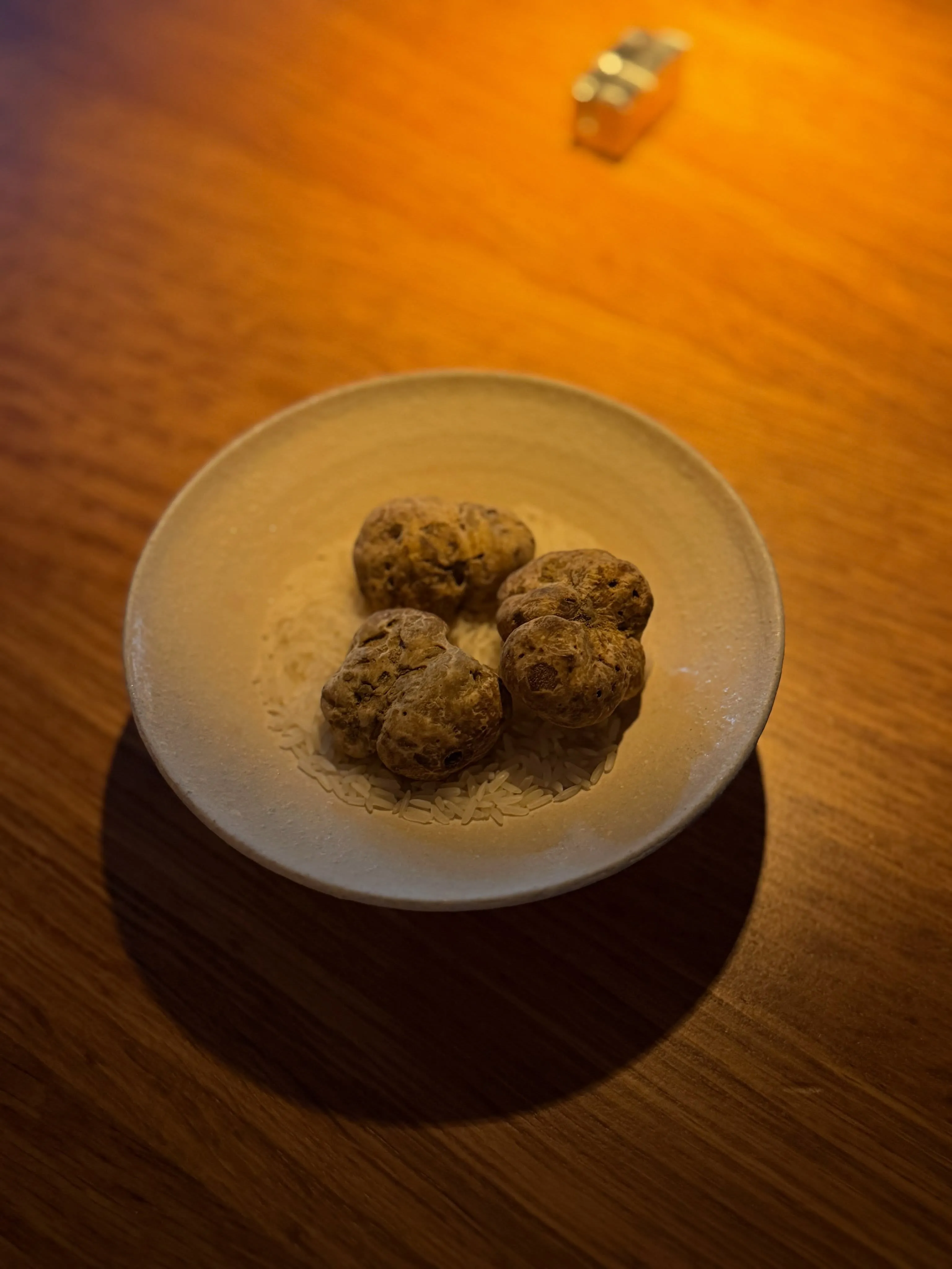 White truffle prepared with jasmine rice and chicken master stock at Ikoyi London