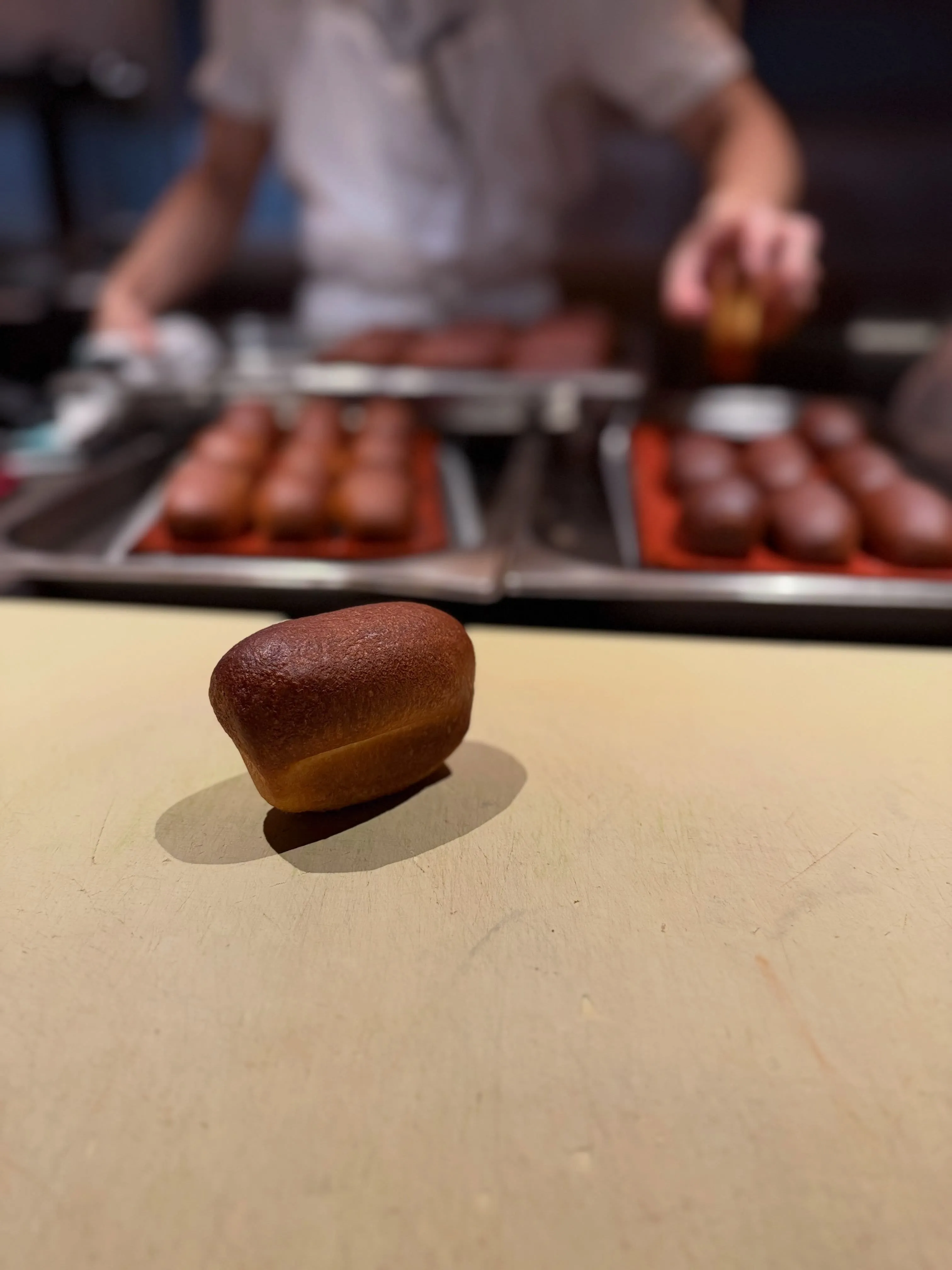 Aerated emmer brioche with caramelised savoury maple butter and roasted laver garnish