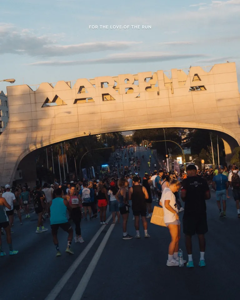 Athletes running through Marbella's streets during the half marathon event