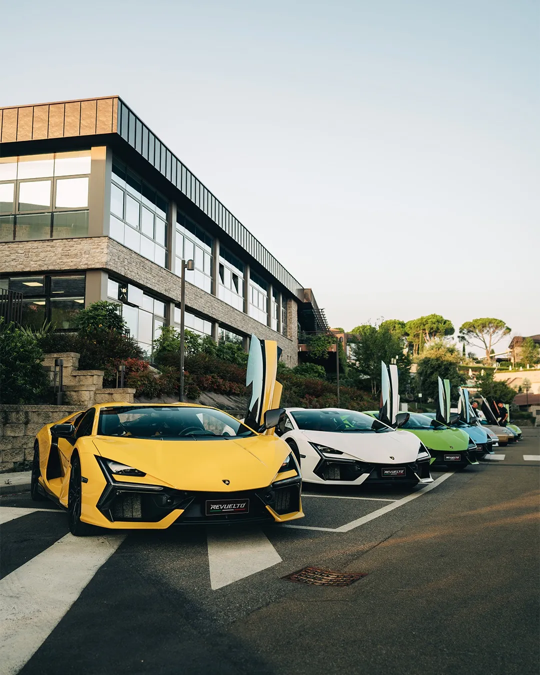 Lamborghini Revuelto hybrid hypercar in dramatic chromatic finish against Alpine landscape
