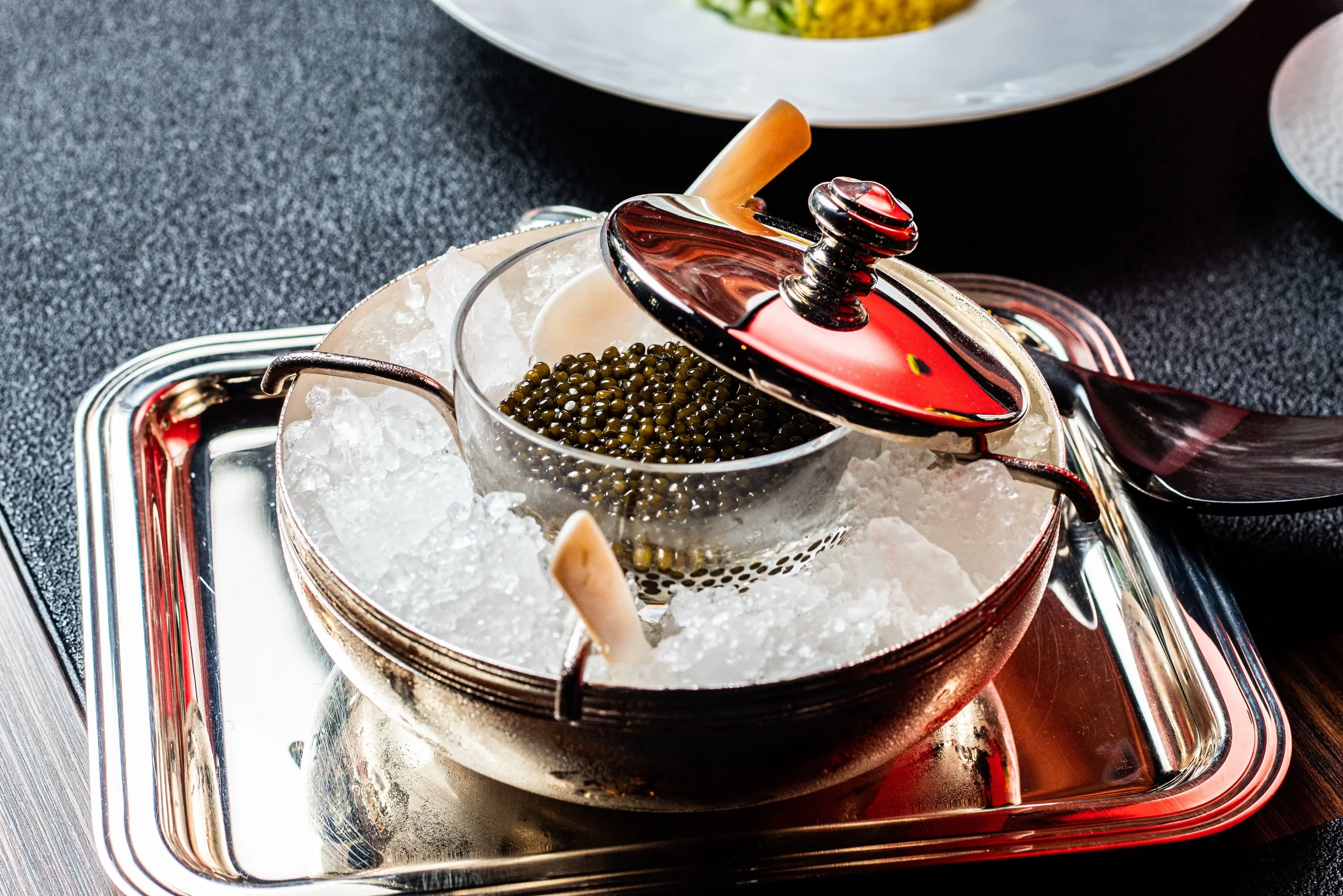 Elegantly plated caviar course at L'Atelier de Joël Robuchon Miami