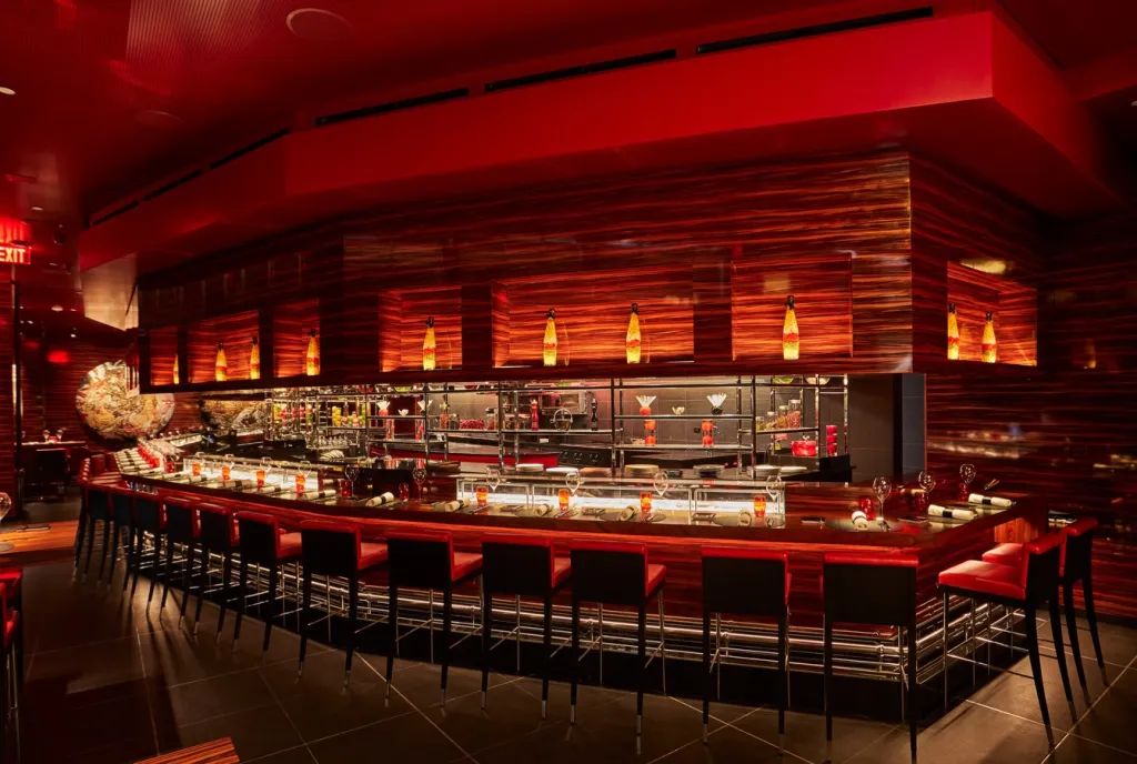 L'Atelier de Joël Robuchon Miami dining room with sophisticated table settings